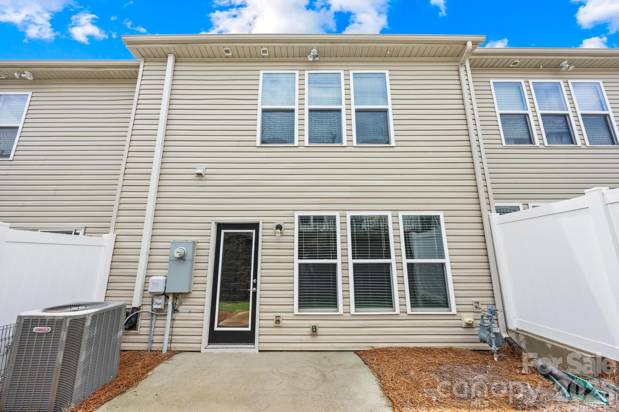 Step outside to a peaceful private patio, perfect for relaxing, entertaining, or enjoying the beautiful Carolina weather. - Charlotte