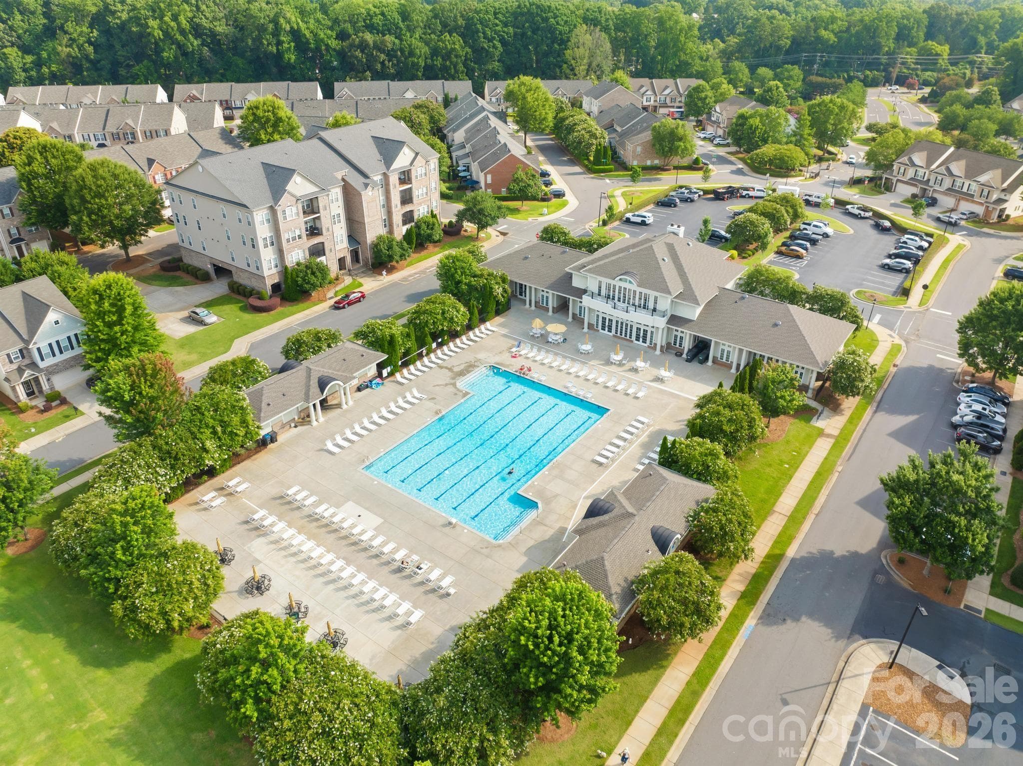 Cool off in the community's impressive junior Olympic swimming pool, one of Park South Station's most popular amenities. - Charlotte