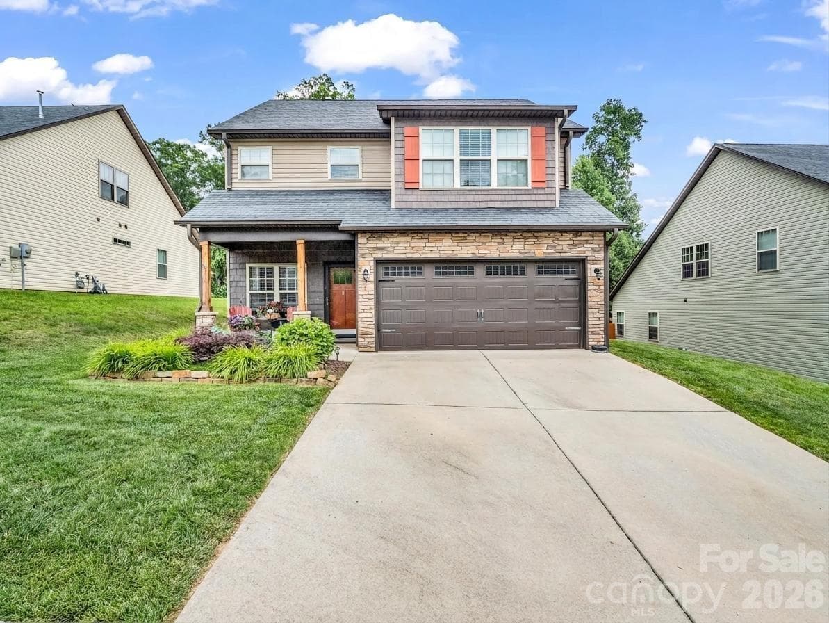 This beautiful home provides a two car garage with plenty of driveway parking as well. - Arden