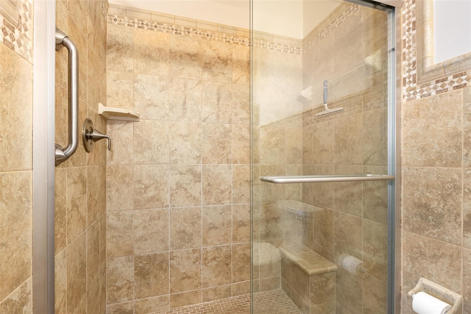 Tiled Shower in Primary Bathroom - 333 N ATLANTIC AVE #305, COCOA BEACH