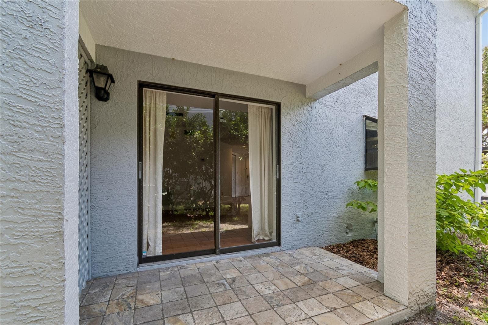 Covered Patio with Entrance to Living RM - 11800 PARK BLVD #401, SEMINOLE