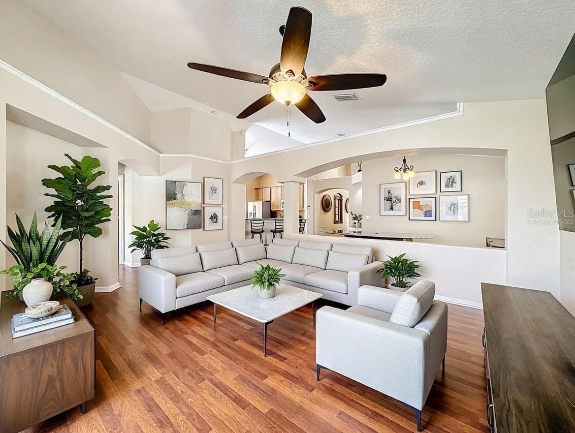 Alternate view of the spacious living area showcasing the bright and airy feel. (Virtually staged) - 7116 COLONY POINTE DR, RIVERVIEW