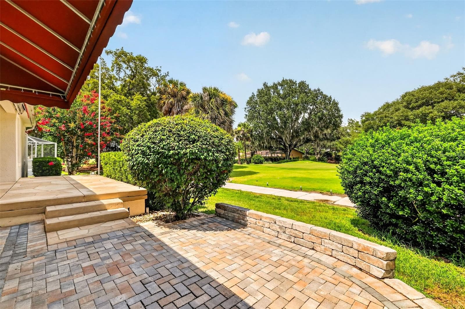 Paver Patio with Incredible Golf Front Views! - 522 LOMA PASEO DR, THE VILLAGES