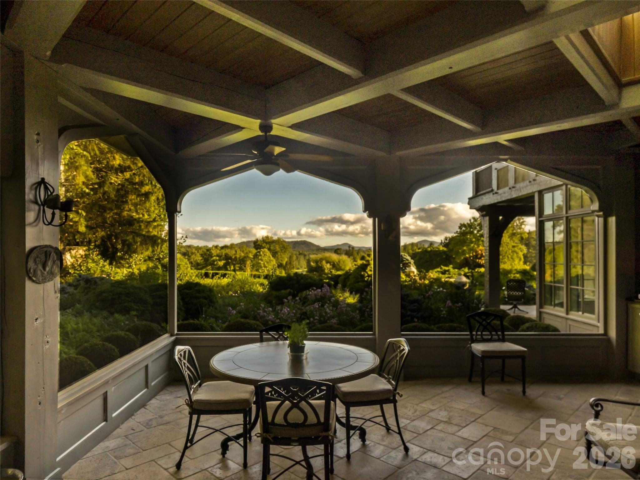 Screened porch with mountain views and built in grill adjoining the kitchen/great room - Biltmore Forest
