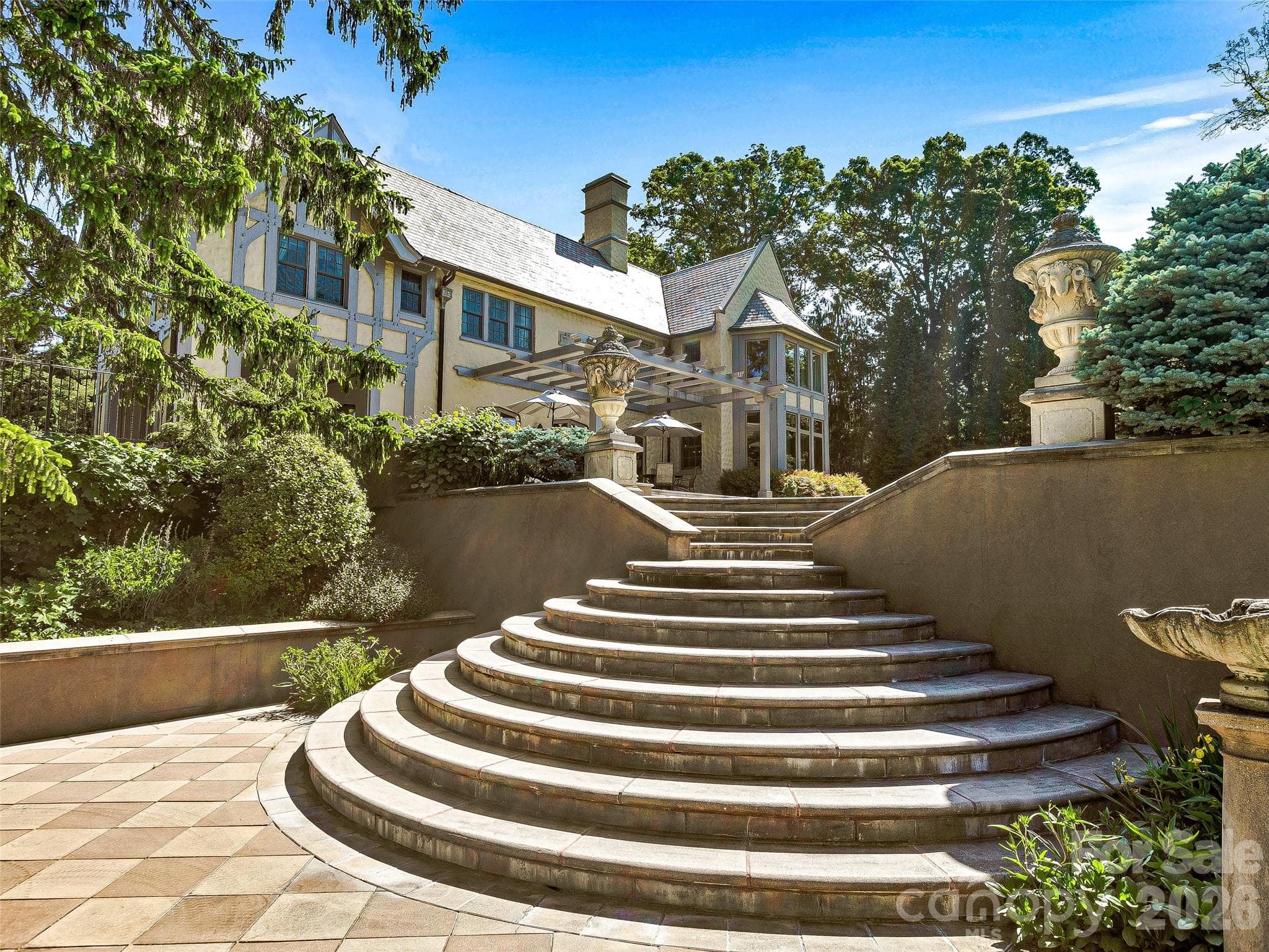 The garden hardscape has an architecture equal to the home - Biltmore Forest