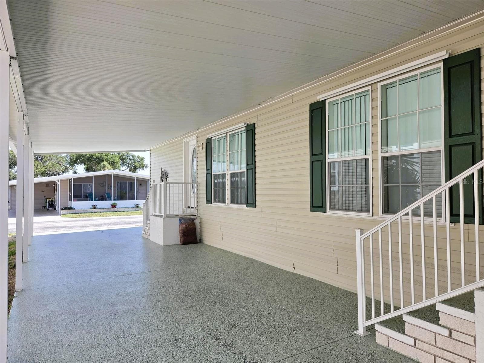 View of carport to the street - 3324 OVERCUP OAK TER, SARASOTA