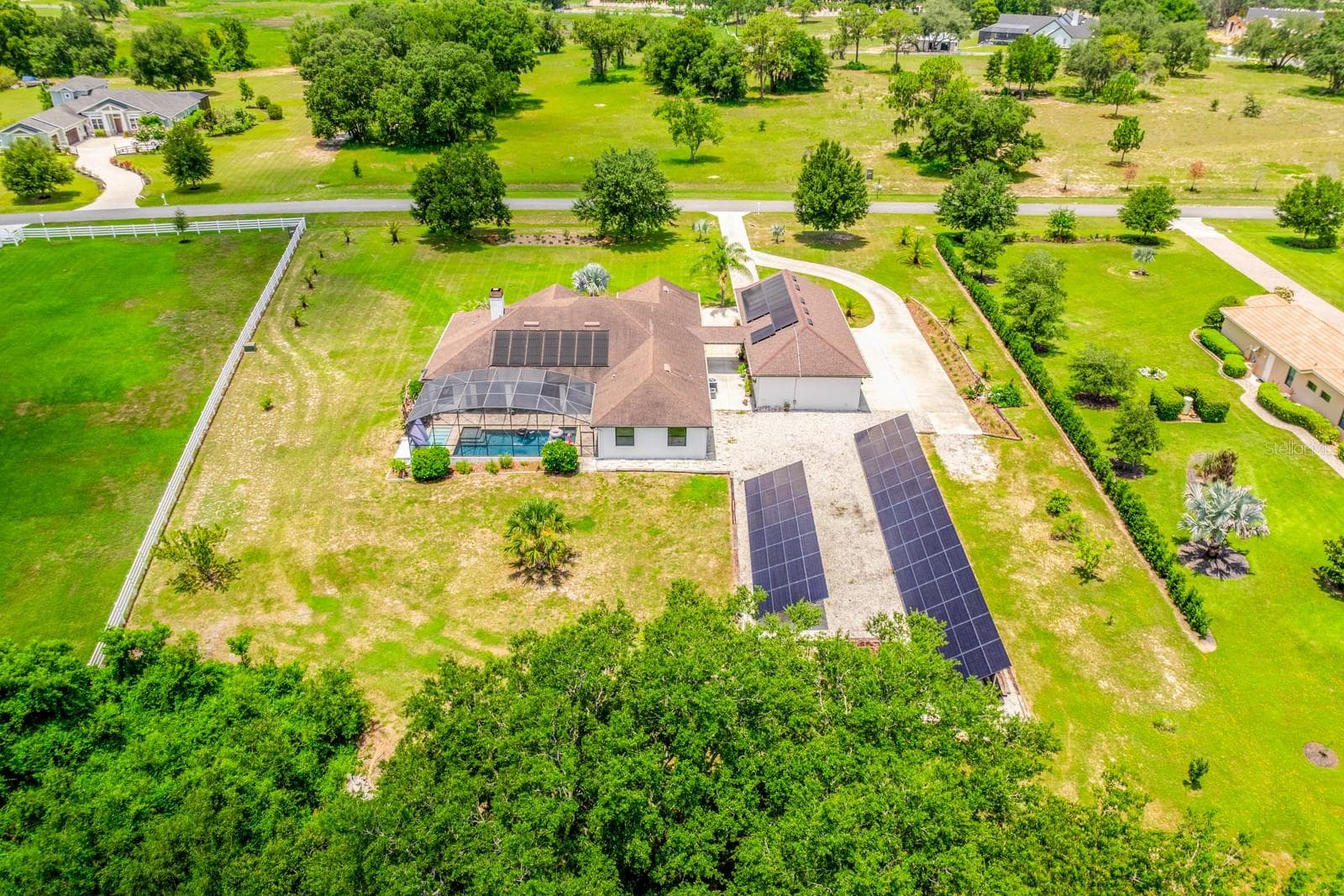Outside, the sprawling property provides beautiful open views, privacy, and room to breathe, all within the sought-after Beauclair Ranch Club, a gated equestrian community known for its spacious homesites and serene setting. - 27324 GRAND OAK LN, TAVARES
