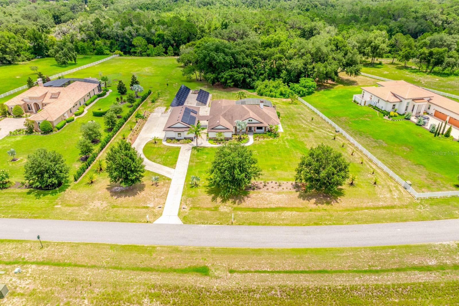 With fully owned solar, a flexible multi-generational layout, resort-style pool living, and acreage inside a gated equestrian community (bring your horses!), this exceptional property truly offers everything you could want in a home… and more! - 27324 GRAND OAK LN, TAVARES
