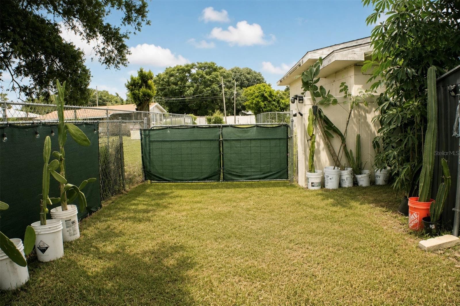 Gate to back alley - 1405 28TH ST NW, WINTER HAVEN
