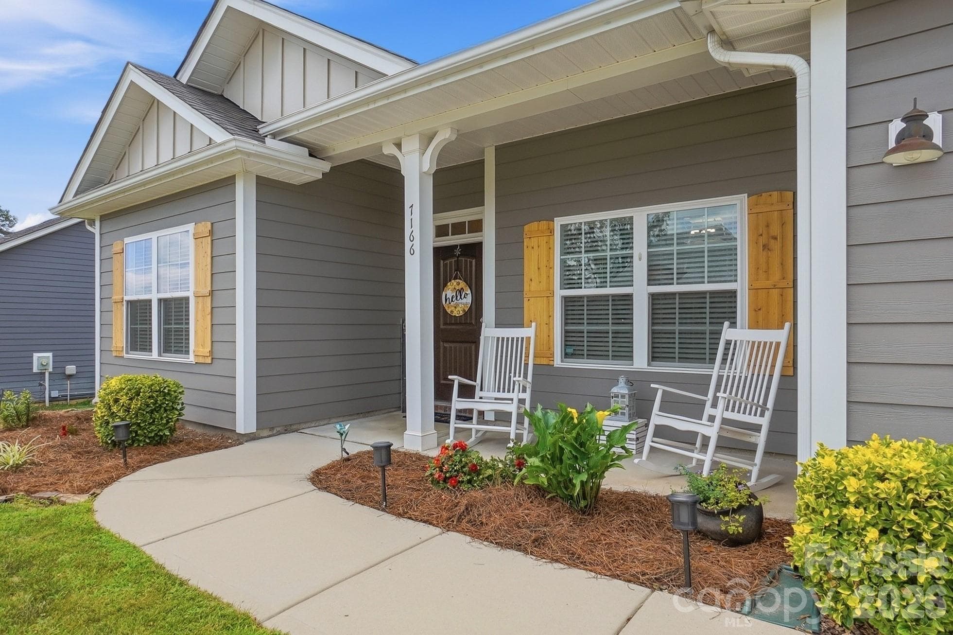 Covered front porch welcomes you home - 7166 Barleywood Drive, Locust