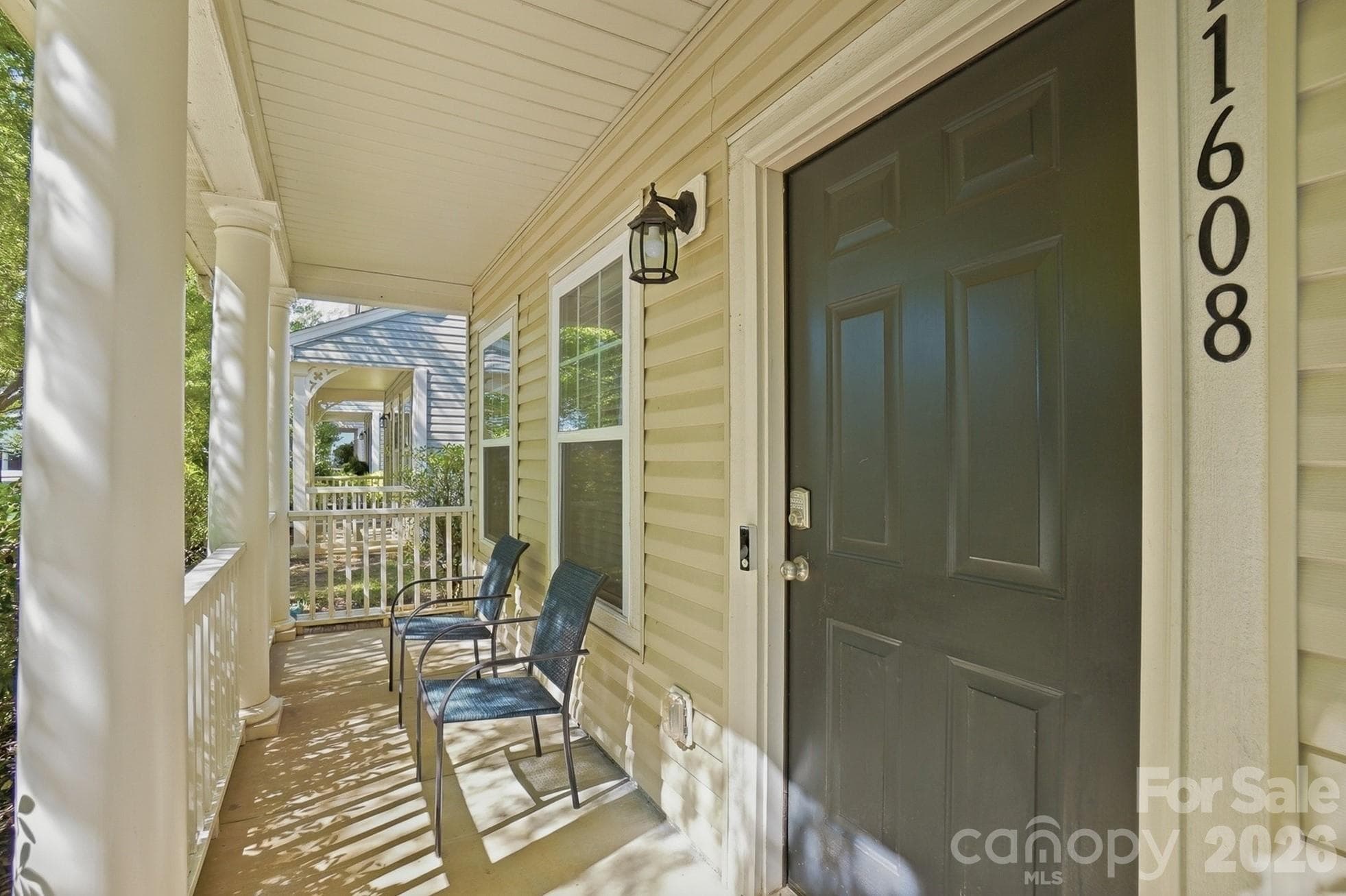A covered front porch to unwind after a long day. - Huntersville