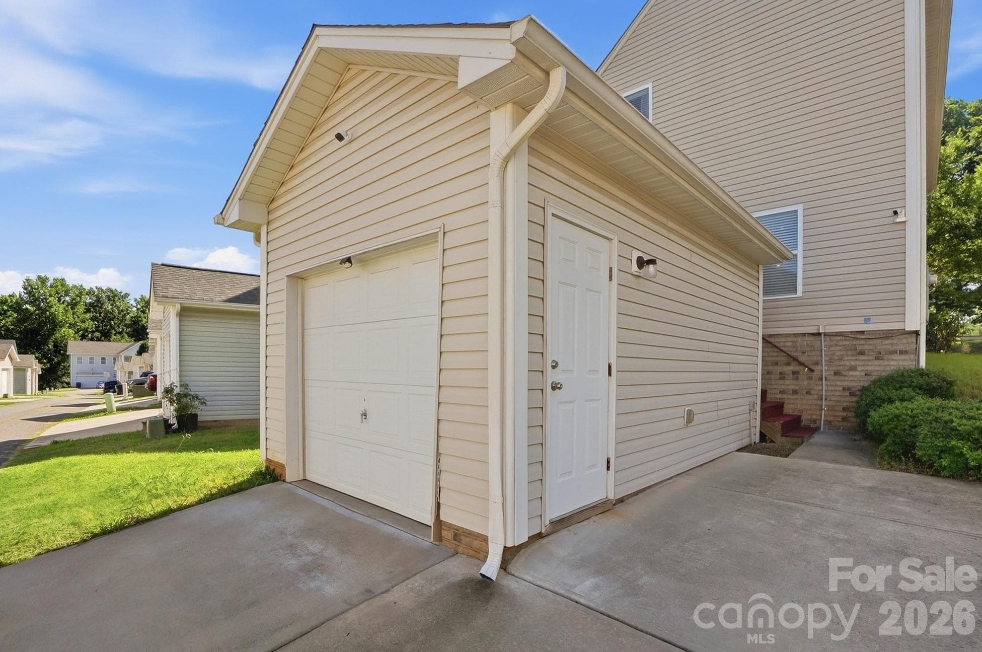 Detached one-car garage plus an additional parking space. - 11608 Galashiels Drive, Huntersville