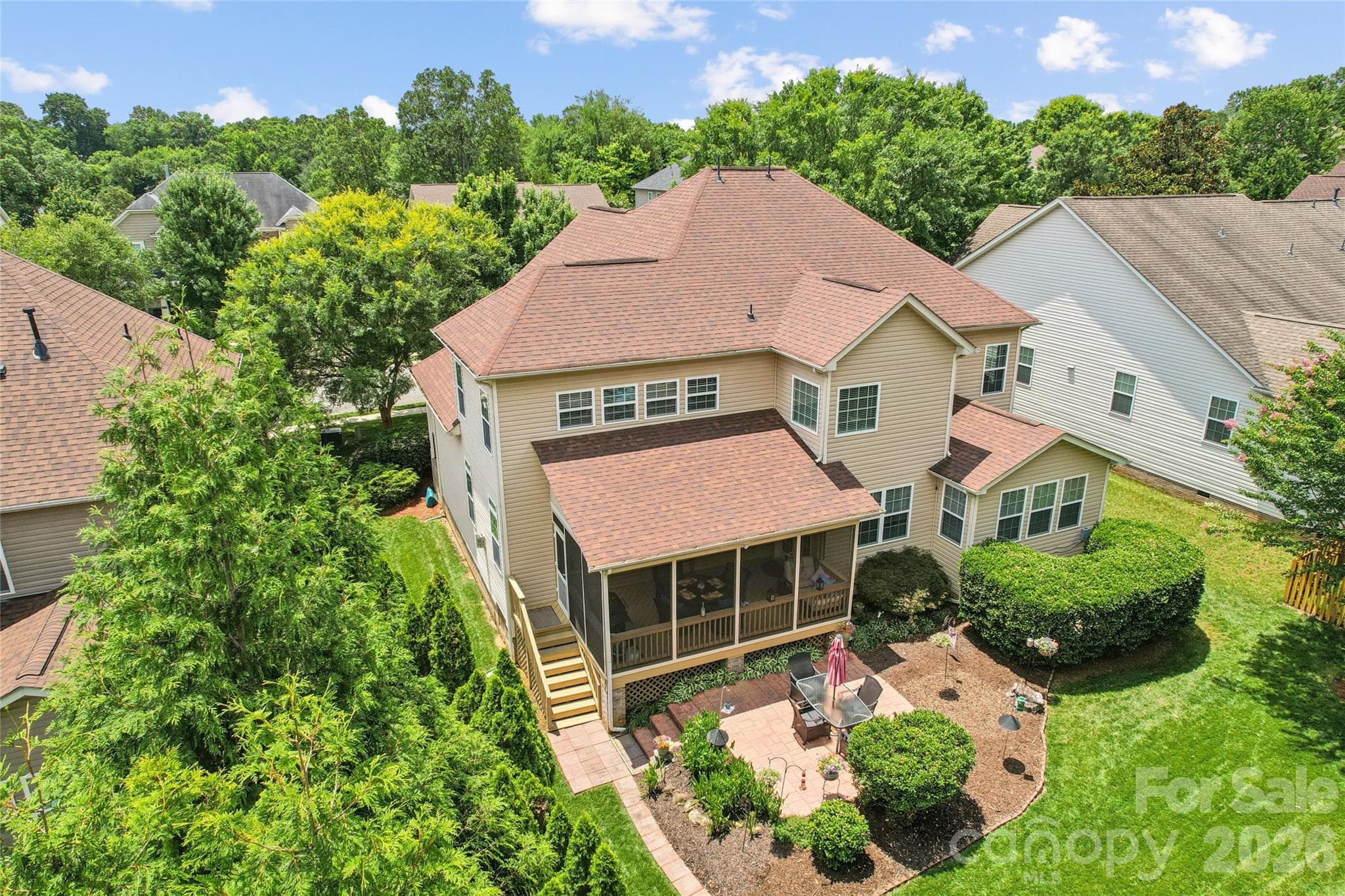 Lush landscaping surrounding home - 8108 Penman Springs Drive, Waxhaw