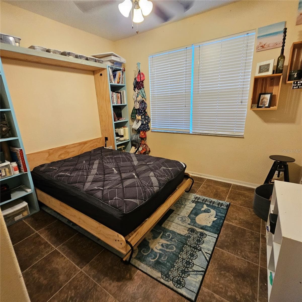 Downstairs bedroom with Murphy bed - 7306 BRIDGEVIEW DR, WESLEY CHAPEL
