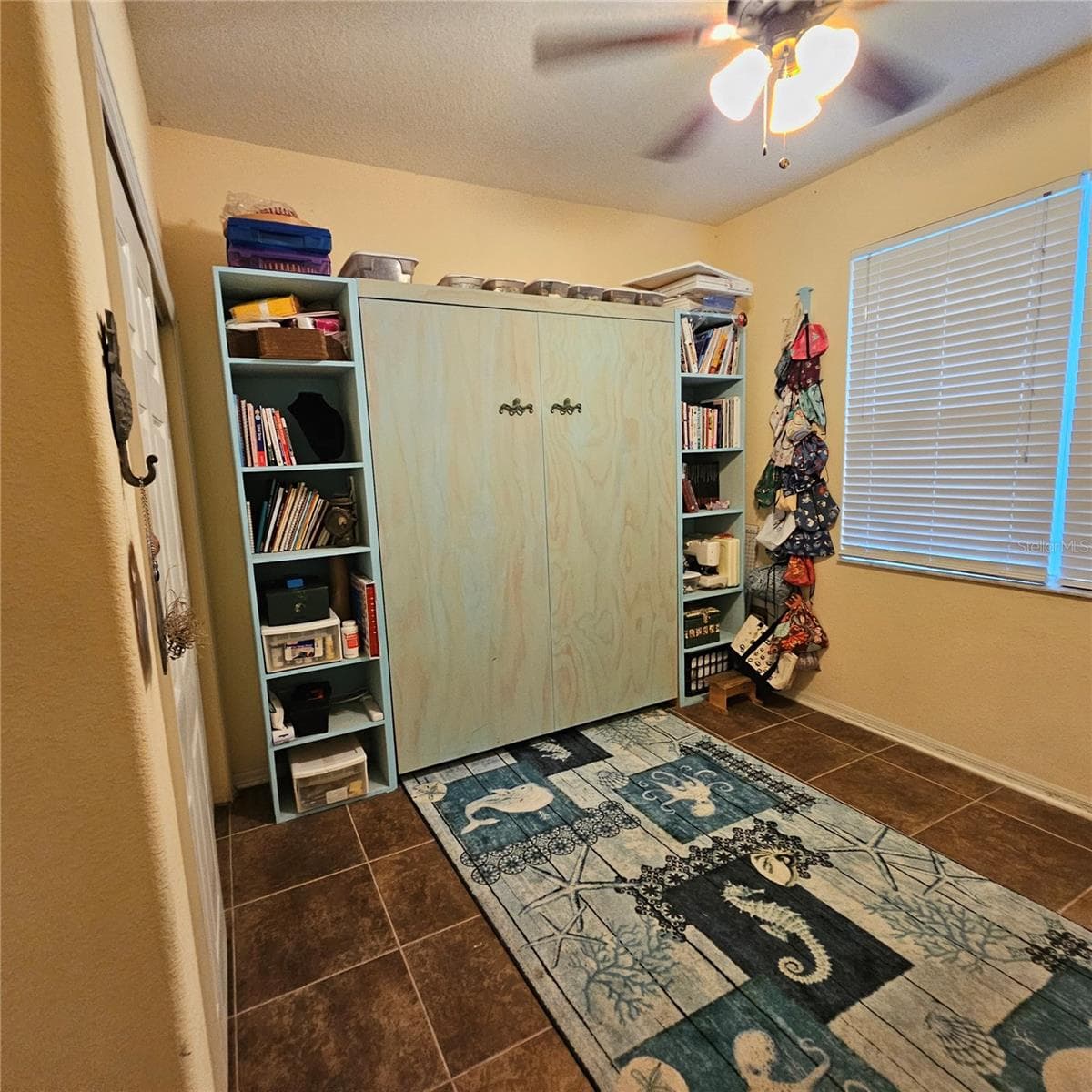 Downstairs bedroom with Murphy Bed - 7306 BRIDGEVIEW DR, WESLEY CHAPEL