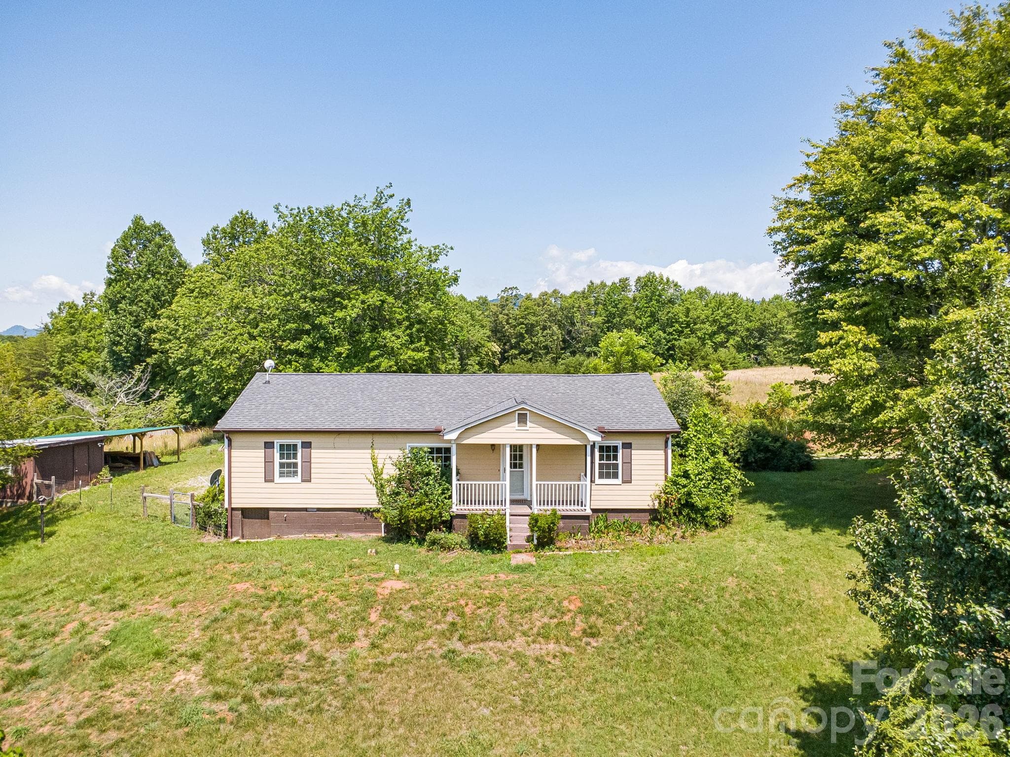 Front of house looking out at large yard. - Lake Lure