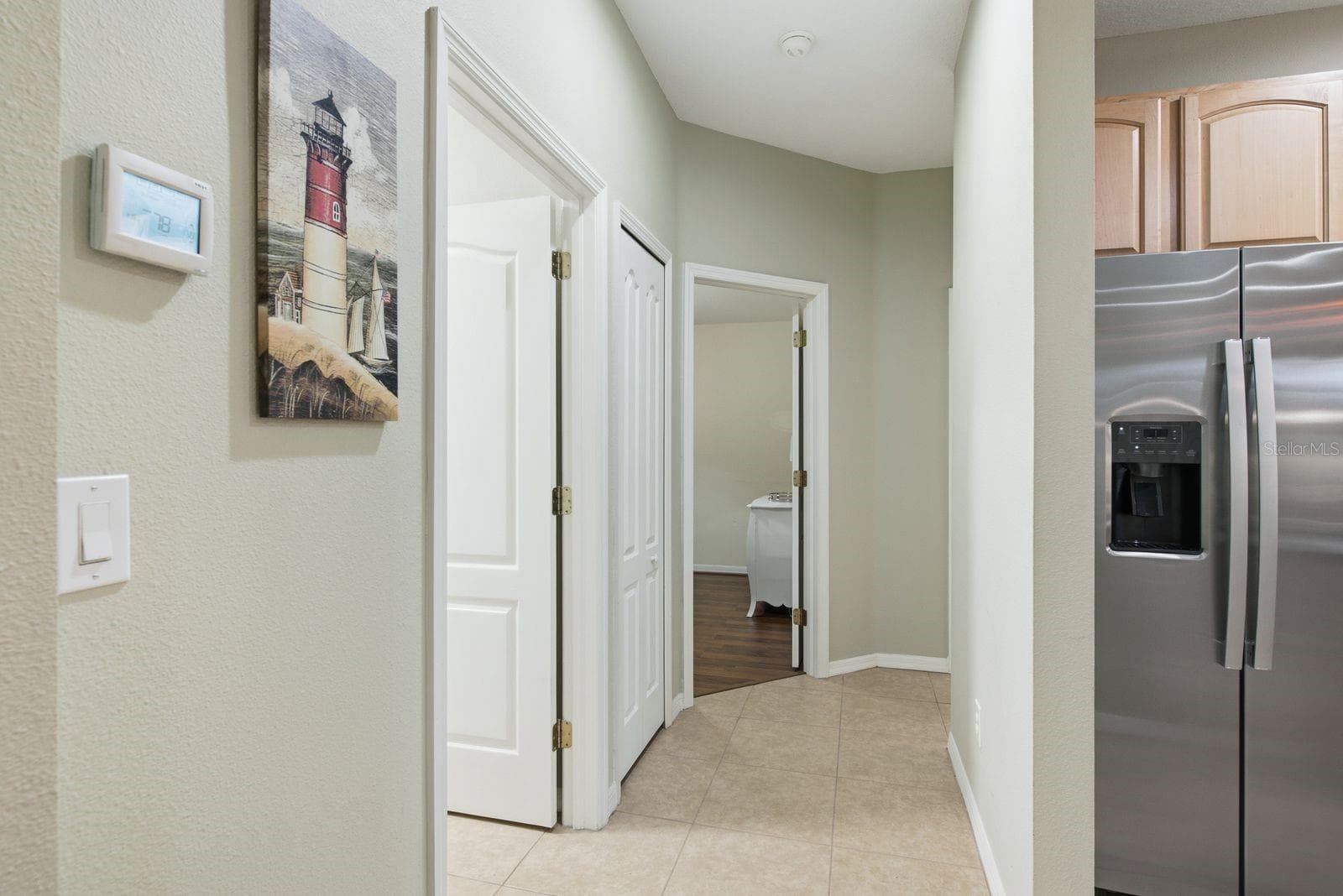 Hallway to two bedrooms - 4882 W BREEZE CIR, PALM HARBOR