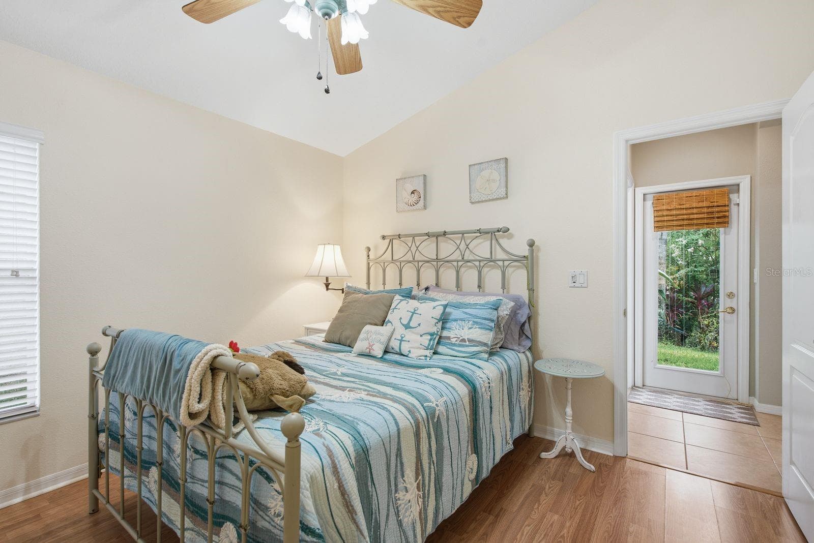Bedroom 4 with access to exterior from hallway and bathroom - 4882 W BREEZE CIR, PALM HARBOR
