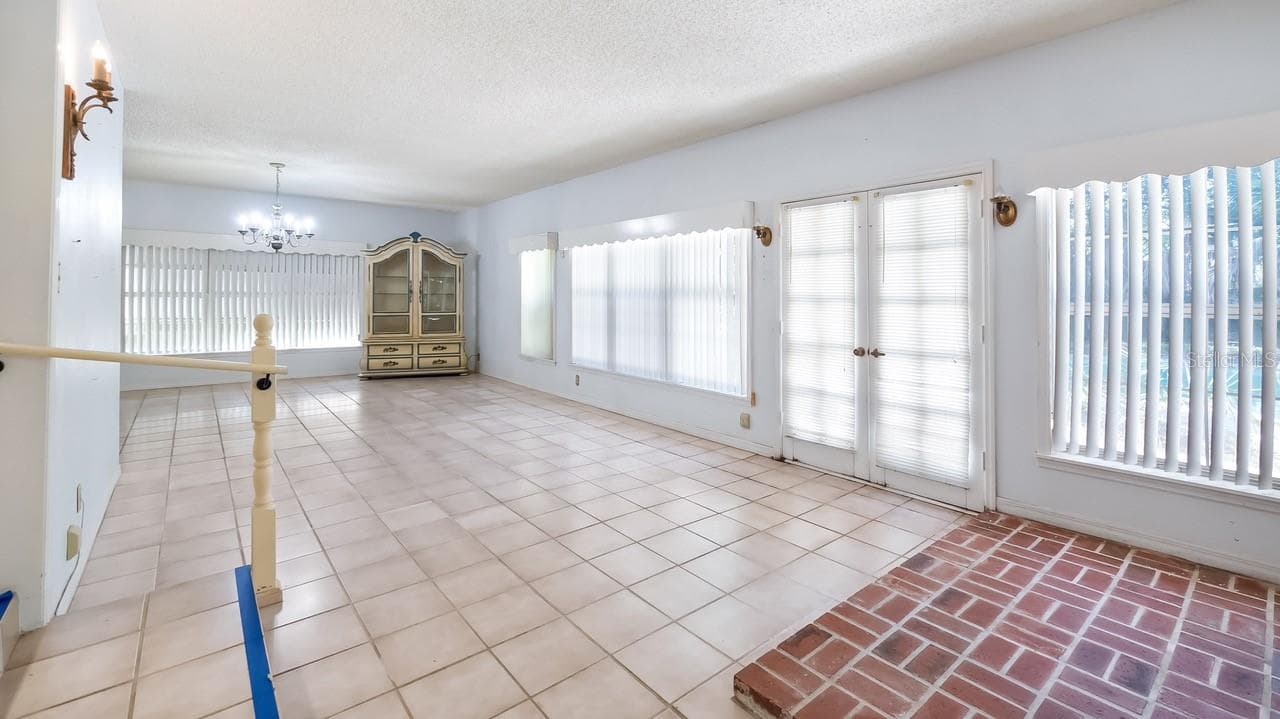 Back enclosed Lanai - 127 E LAUREL AVE, HOWEY IN THE HILLS