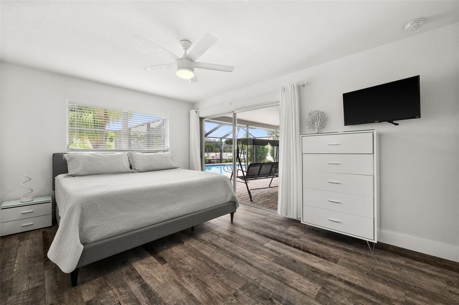 Master Bedroom with sliding door directly to the lanai / pool area - 5122 SW 3RD AVE, CAPE CORAL