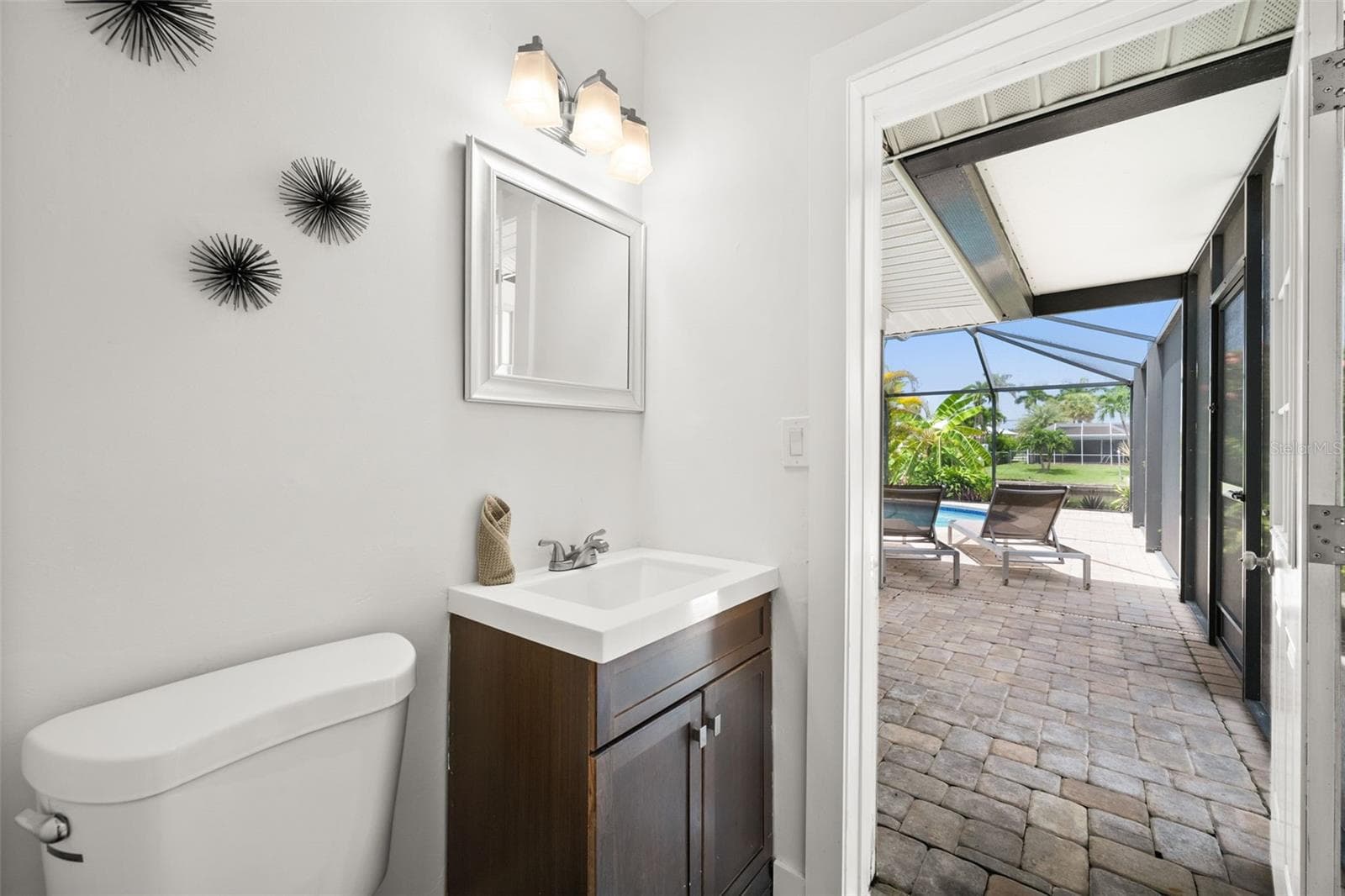3rd full bath doubles as a pool bath - 5122 SW 3RD AVE, CAPE CORAL