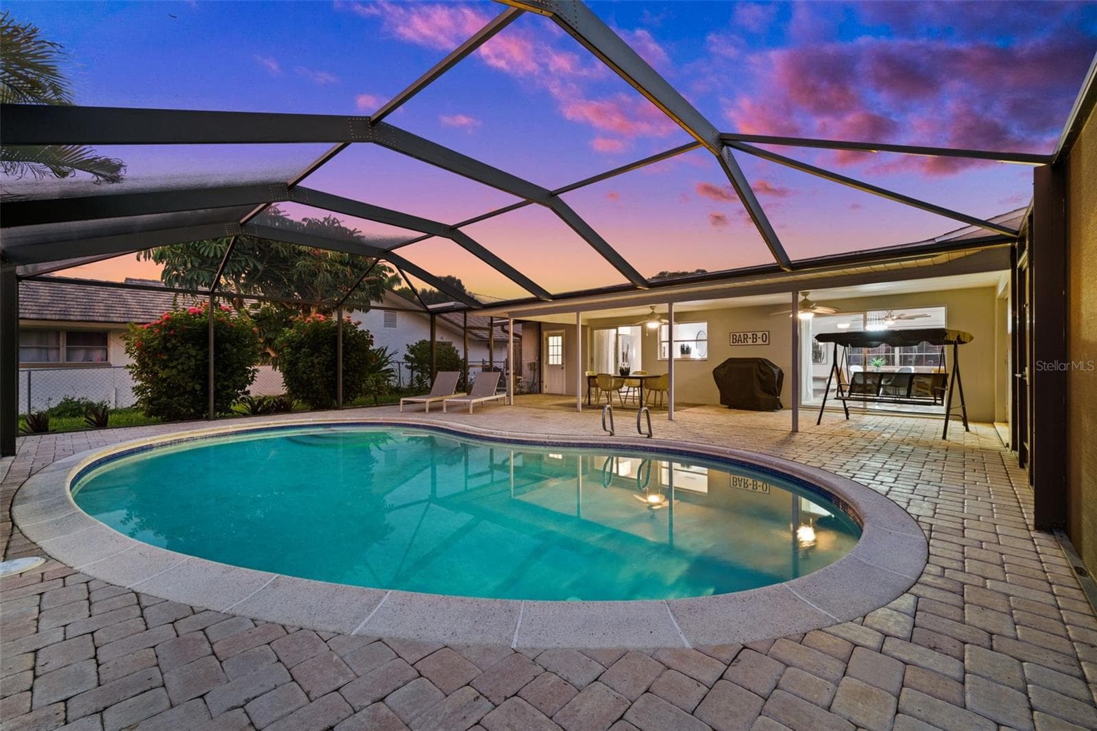 The heated pool is ready for an evening swim - 5122 SW 3RD AVE, CAPE CORAL