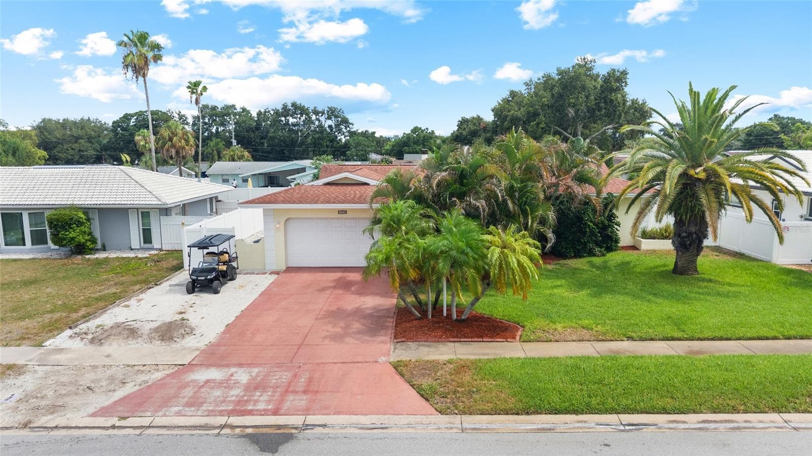 2 car Garage plus extra Shell Parking Pad for Golf Cart, Boat, 3rd vehicle, etc. - 1070 MCCARTY ST, DUNEDIN