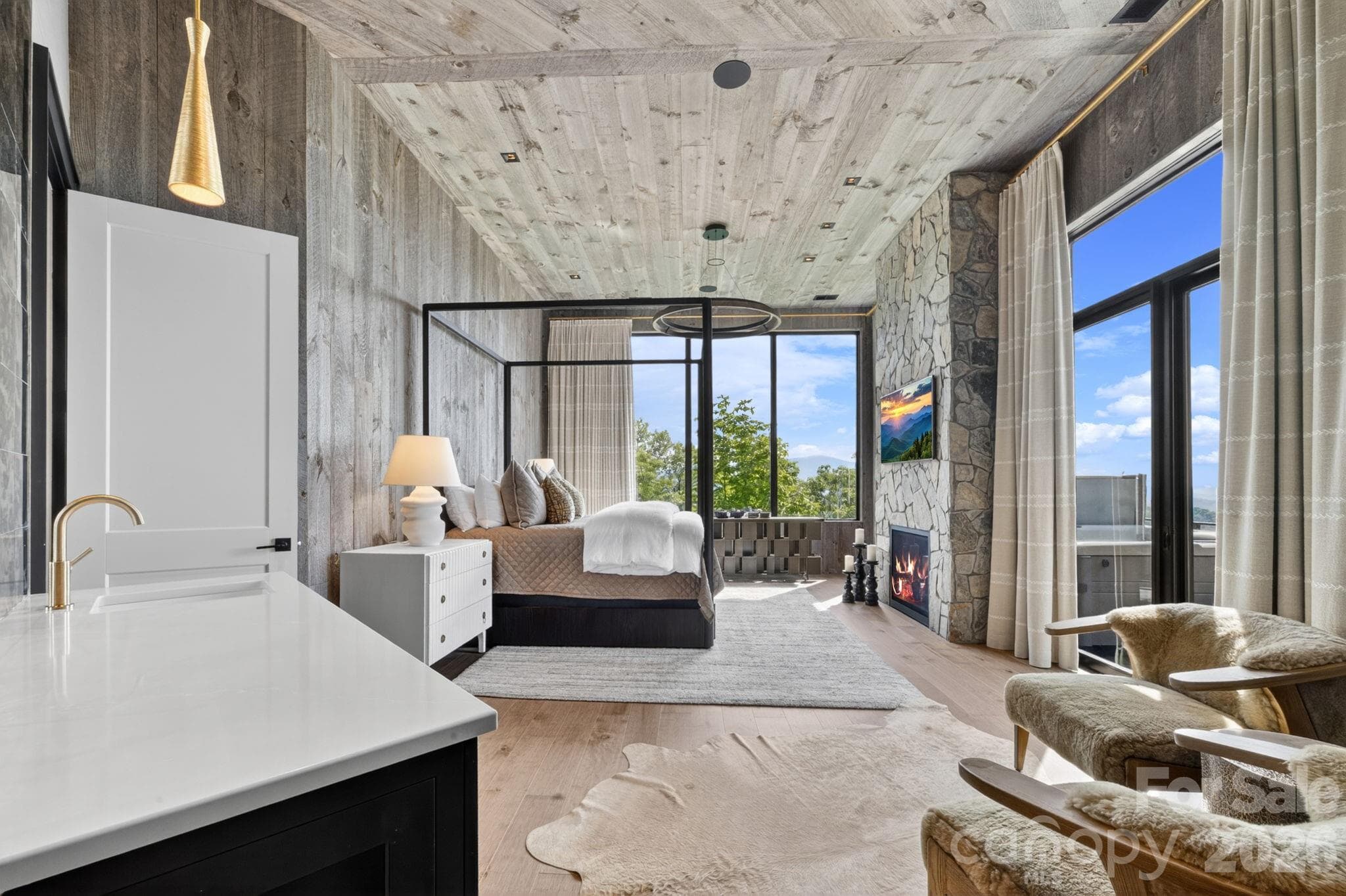 Primary suite with fireplace, beverage bar and sitting area - 270 Osprey Drive, Banner Elk