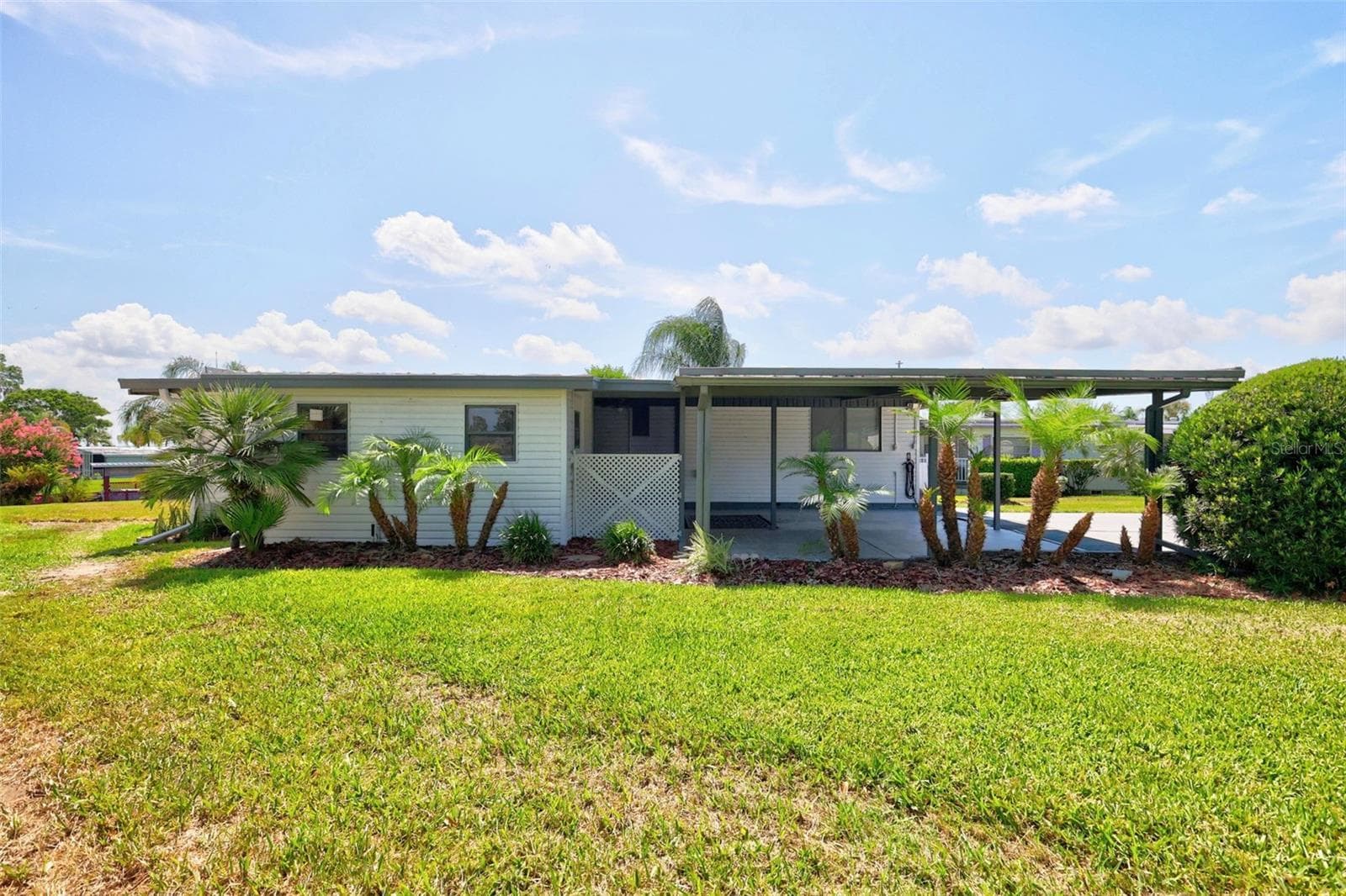 Street view w/mature landscaping - 34312 CARL RD, LEESBURG