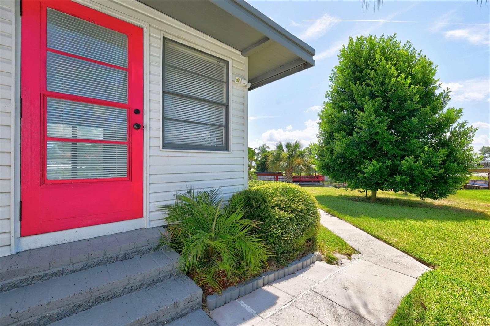 Back door w/walkway to canal - 34312 CARL RD, LEESBURG