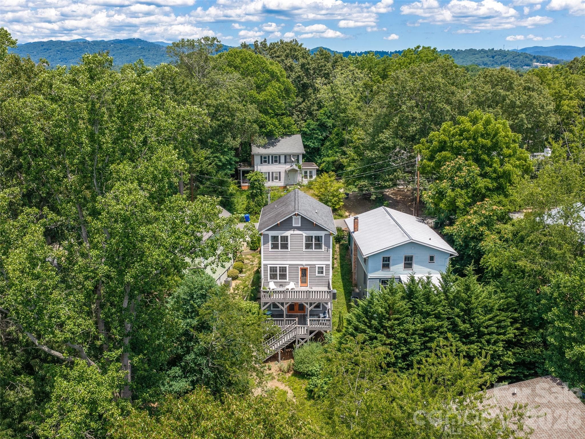 Aerial view from back of home with mountain vistas in the background. - 60 Mardell Circle, Asheville