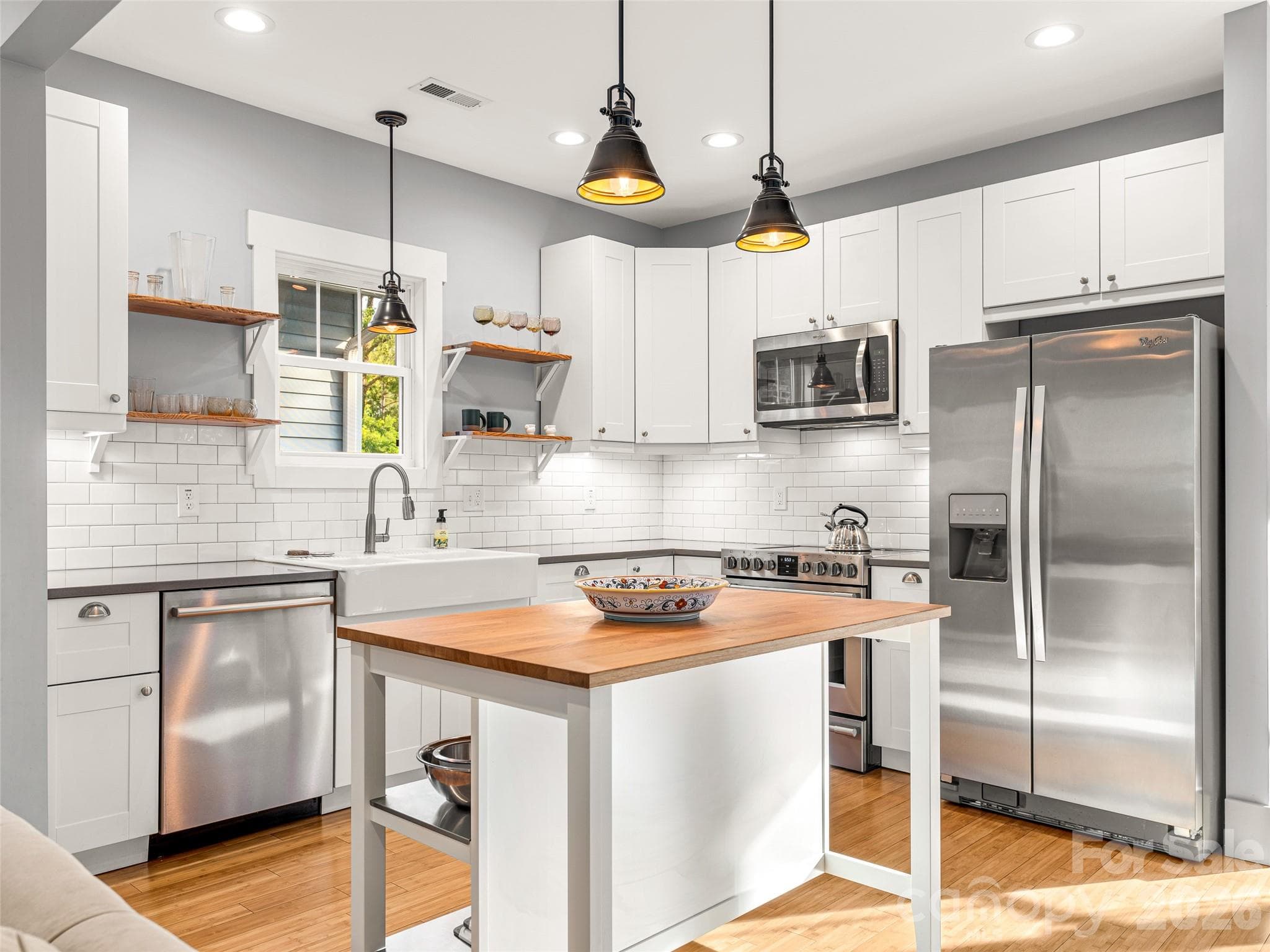 Subway tile and stainless steel appliances. - 60 Mardell Circle, Asheville