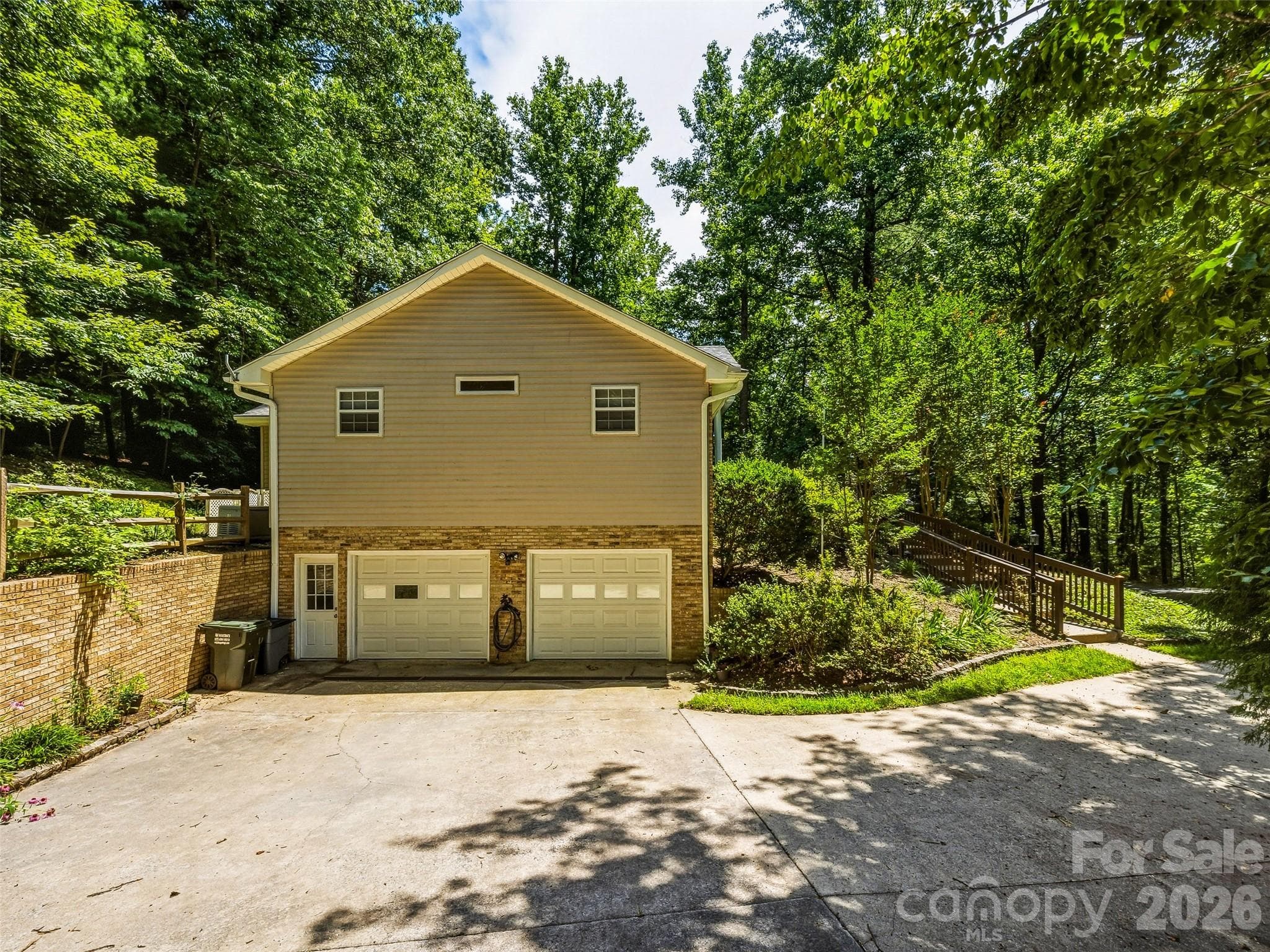Attached garage on lower level - 206 Camellia Way, Laurel Park