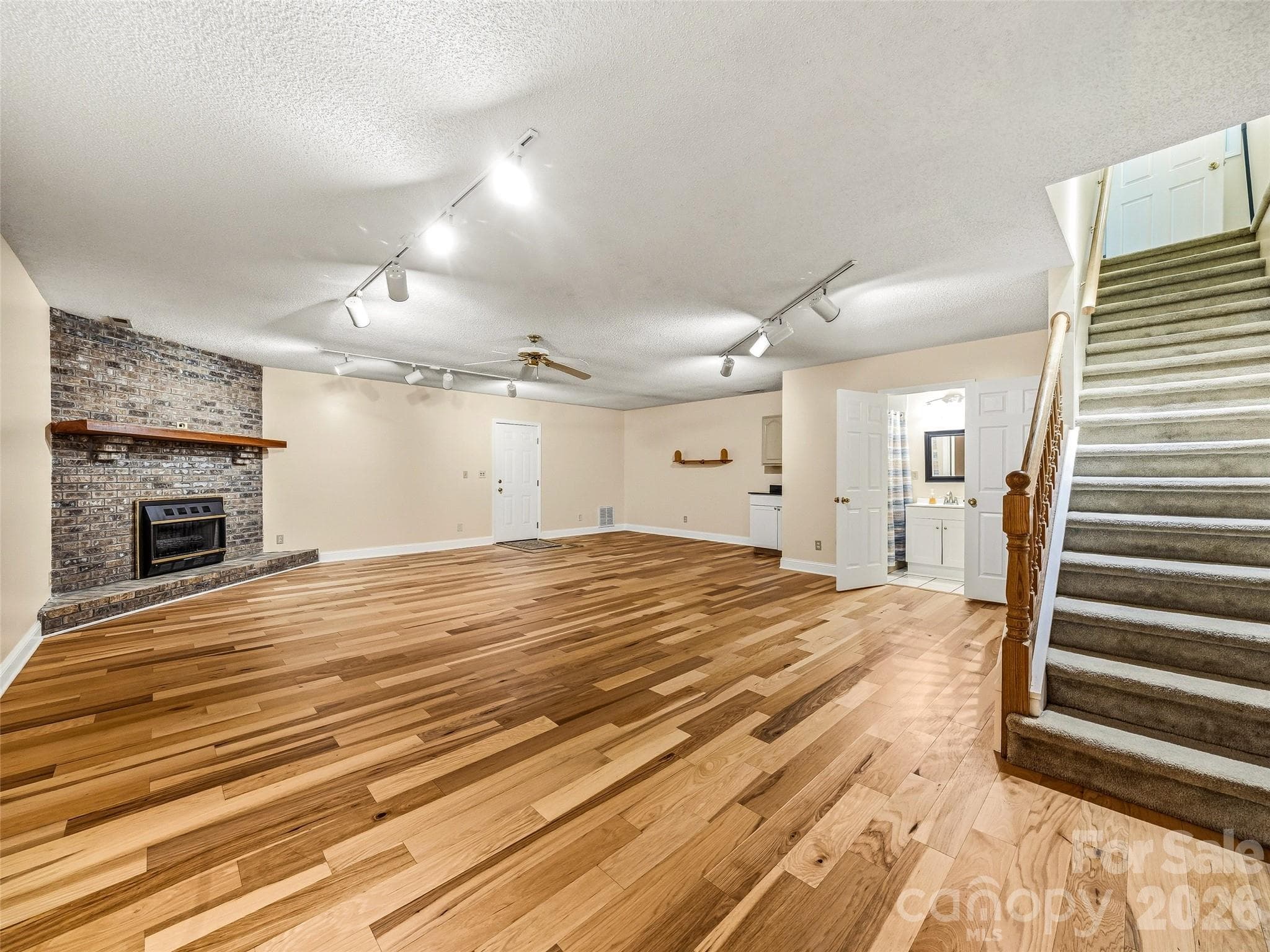 Lower level-fully finished with full bath and small kitchen sink - 206 Camellia Way, Laurel Park