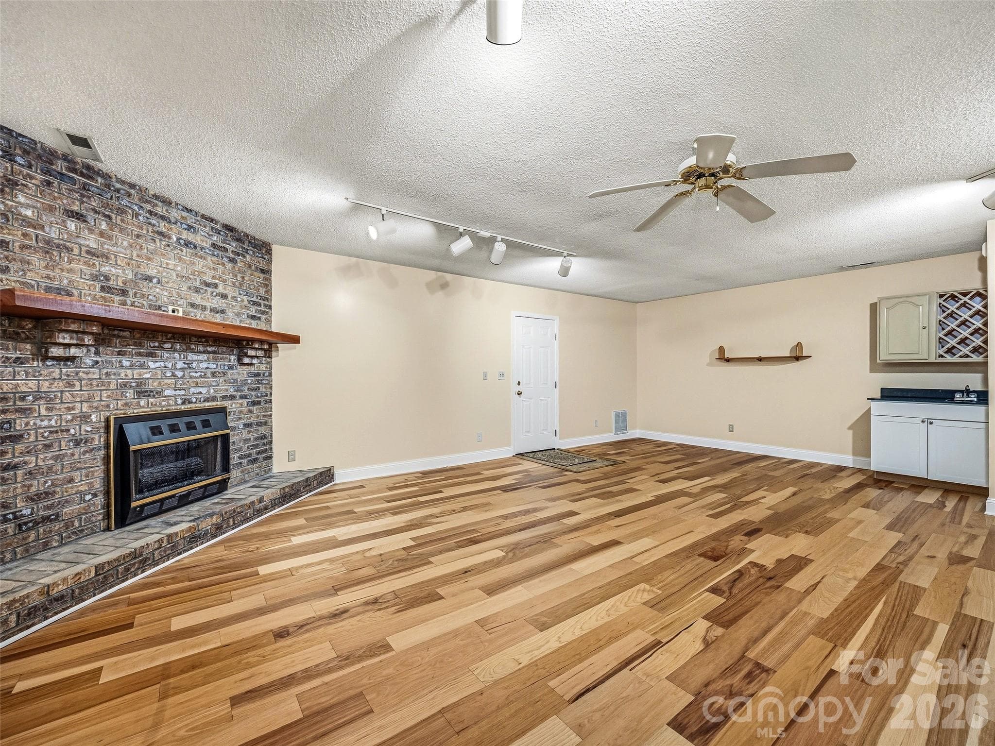 Fireplace in lower level - 206 Camellia Way, Laurel Park