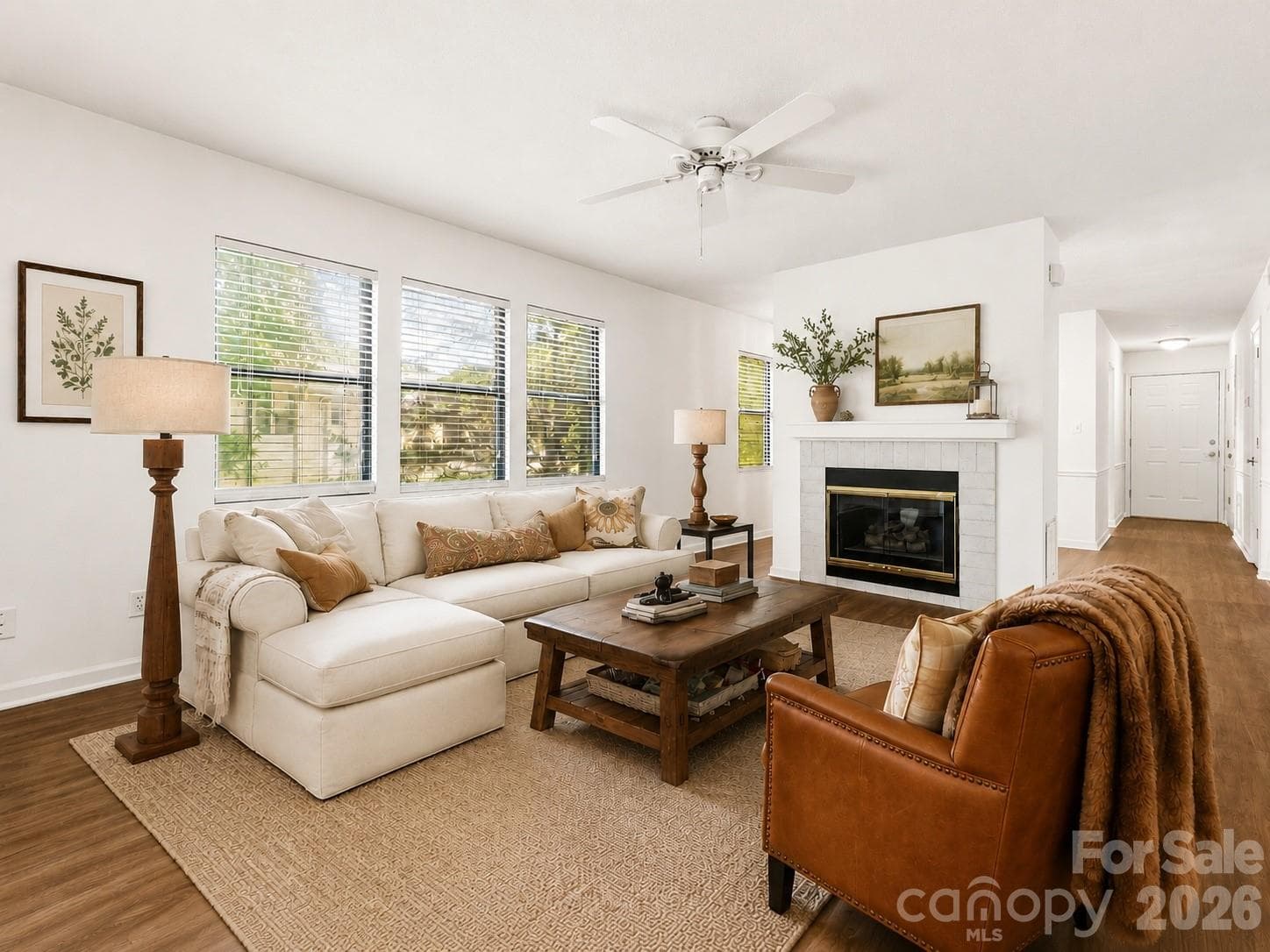 Virtually Staged - Cozy Living room has abundant natural light and gas fireplace - Asheville