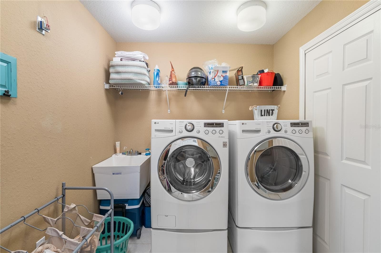 laundry room and a bit of storage - 3805 GULF BLVD #203, ST PETE BEACH