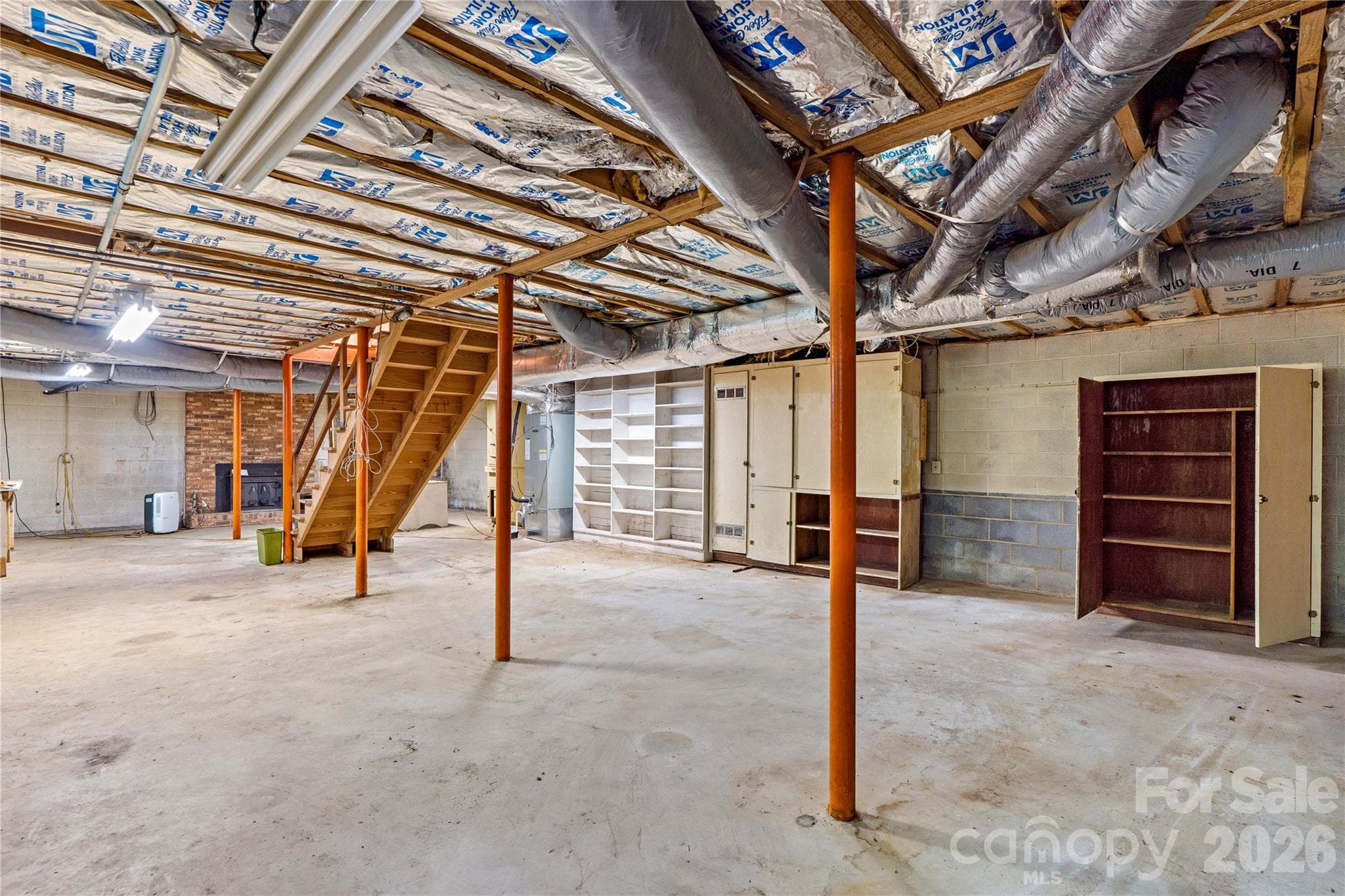 Excellent space that offers many options in this walk out basement with wood burning fireplace, a shower, & sink are also installed. - 155 Duck Creek Road, Troutman