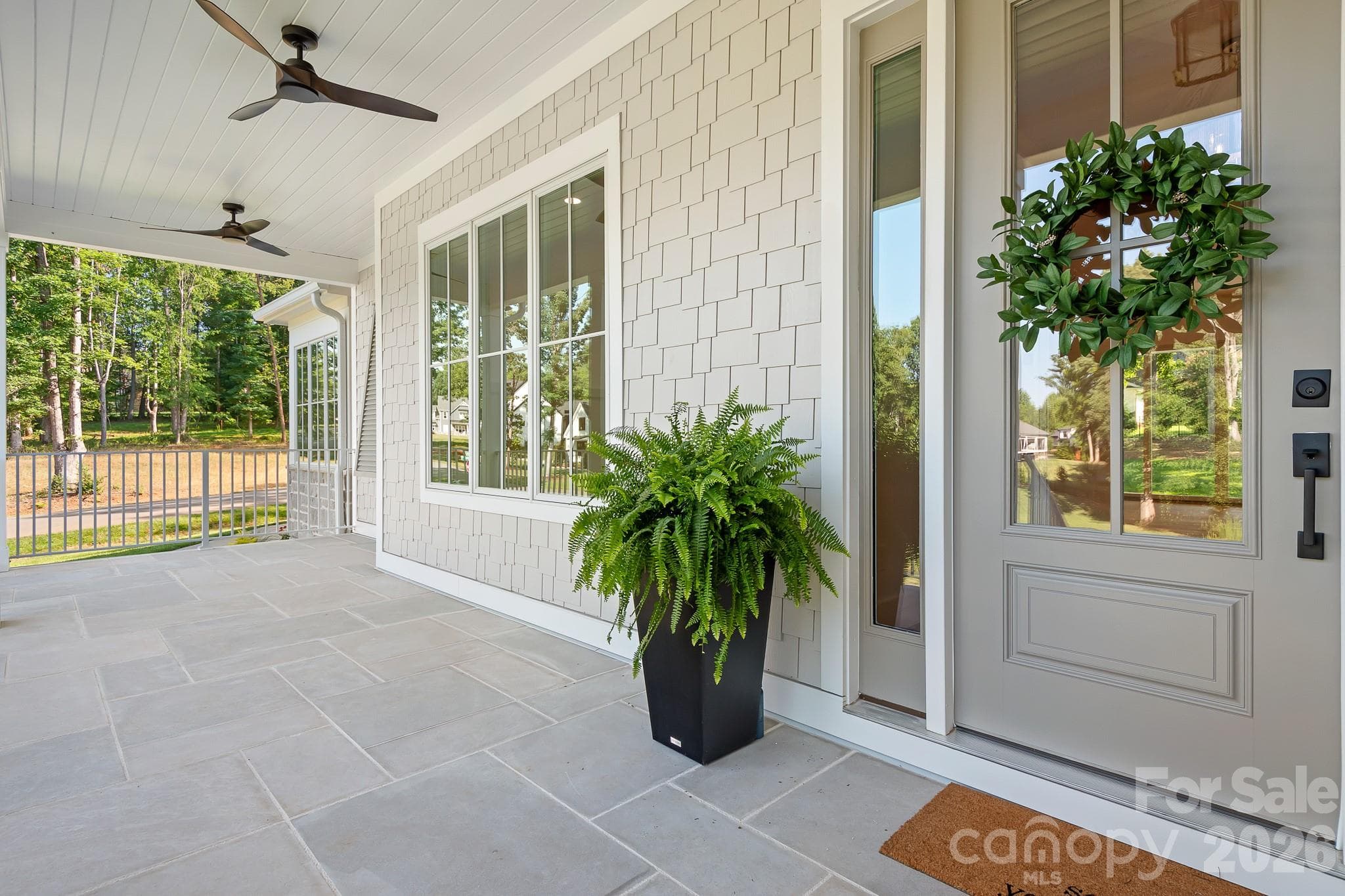 Great Limestone front porch with fans and room for a sofa swing - Mooresville