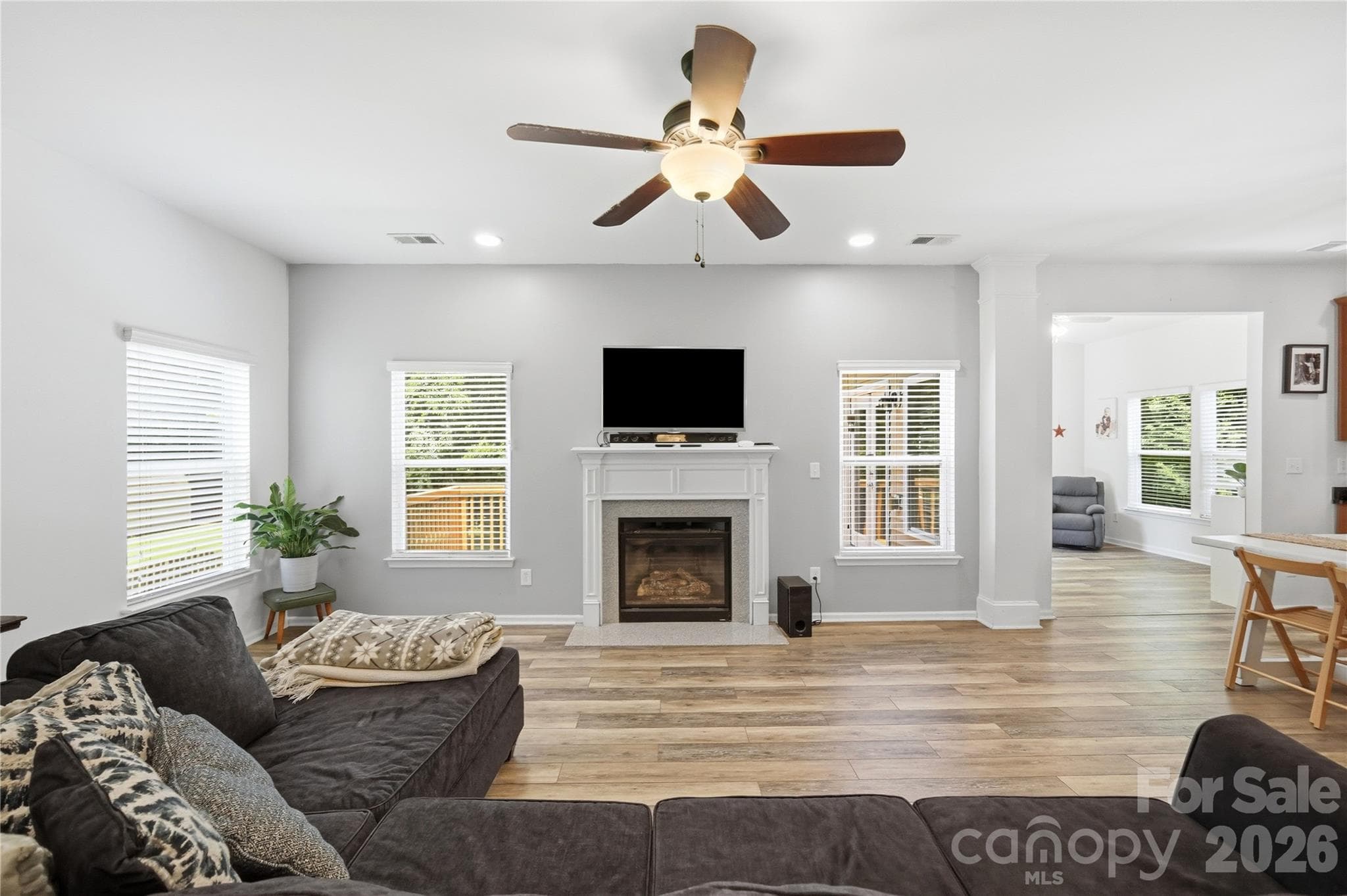 Cozy up by the gas-log fireplace in the light-filled great room - Indian Trail