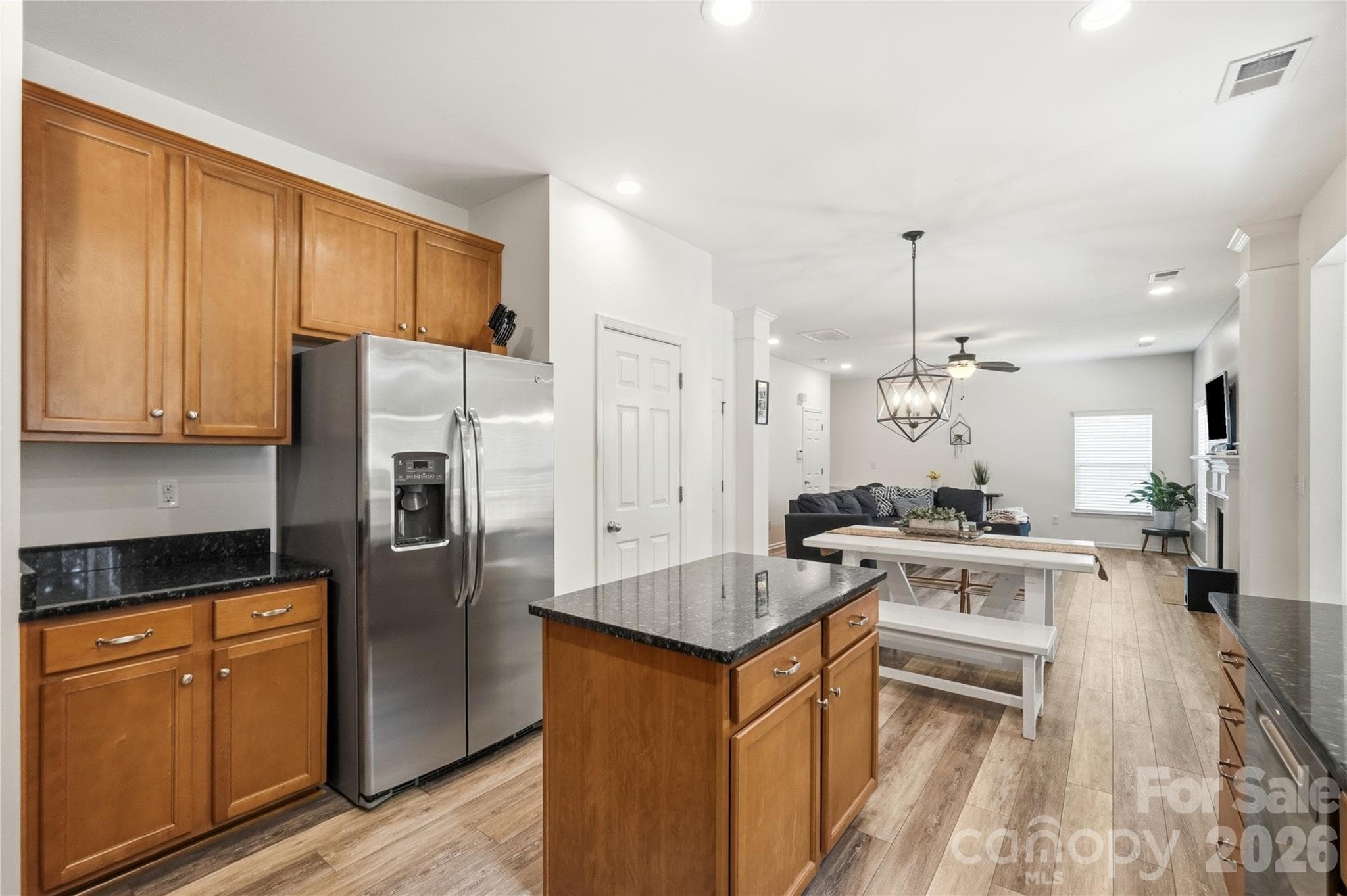 Open kitchen with generous counter space and breakfast seating - Indian Trail