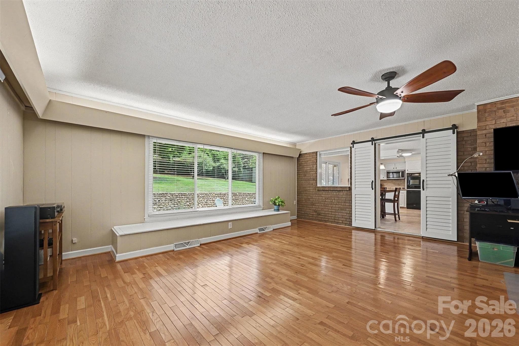 Large sunroom off side door entrance with beautiful hardwood floors - Huntersville