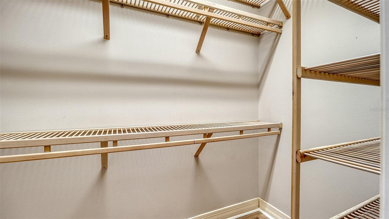 2 walk-in closets with wood custom shelving - 4360 BRANDYWINE DR, SARASOTA