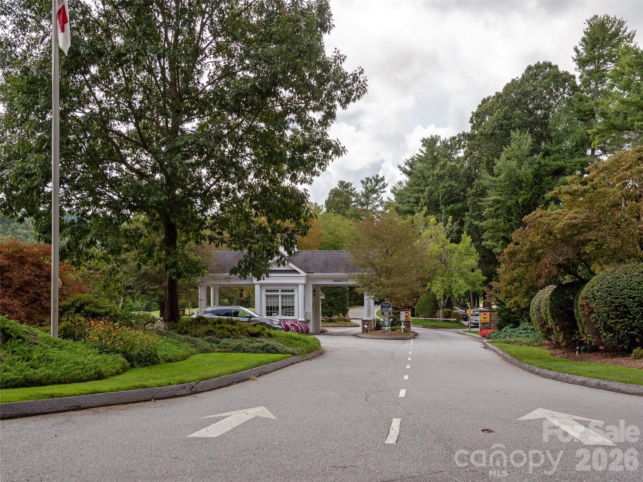 Security gate entry provides controlled access and added peace of mind within the community. - 128 Pinnacle Peak Lane, Flat Rock