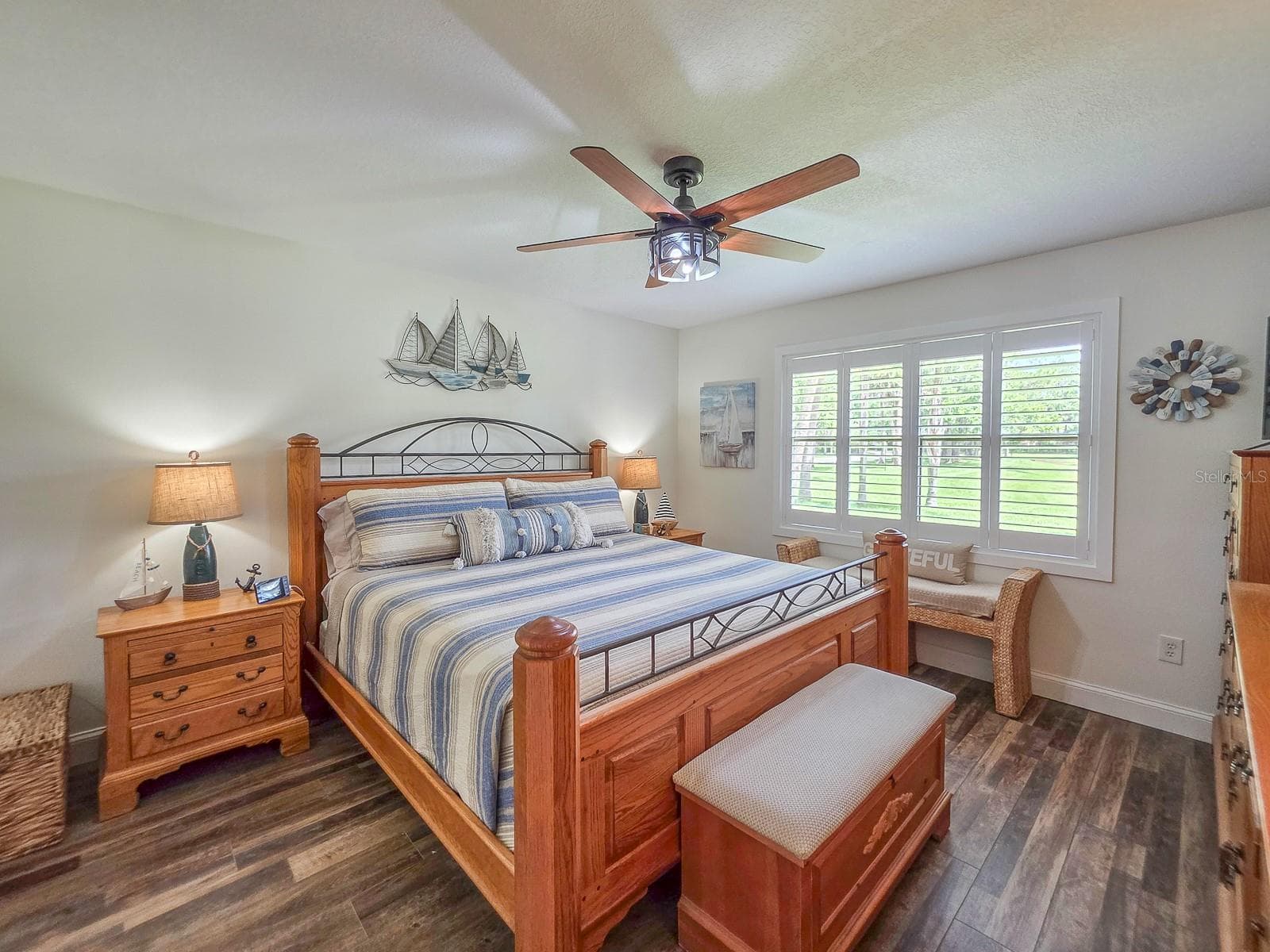 Primary Bedroom with Plantation Shutters - 100 SEA PINES CIR, DAYTONA BEACH