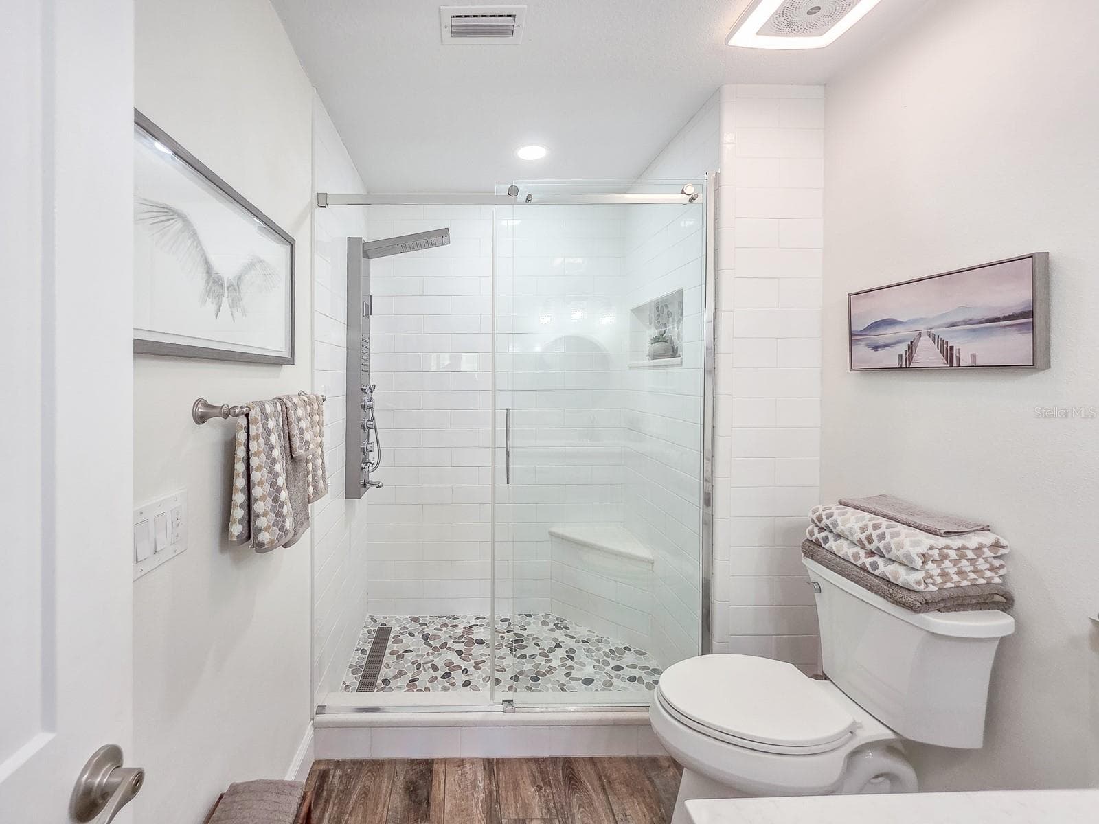 Primary En Suite Bathroom with luxury shower system - 100 SEA PINES CIR, DAYTONA BEACH