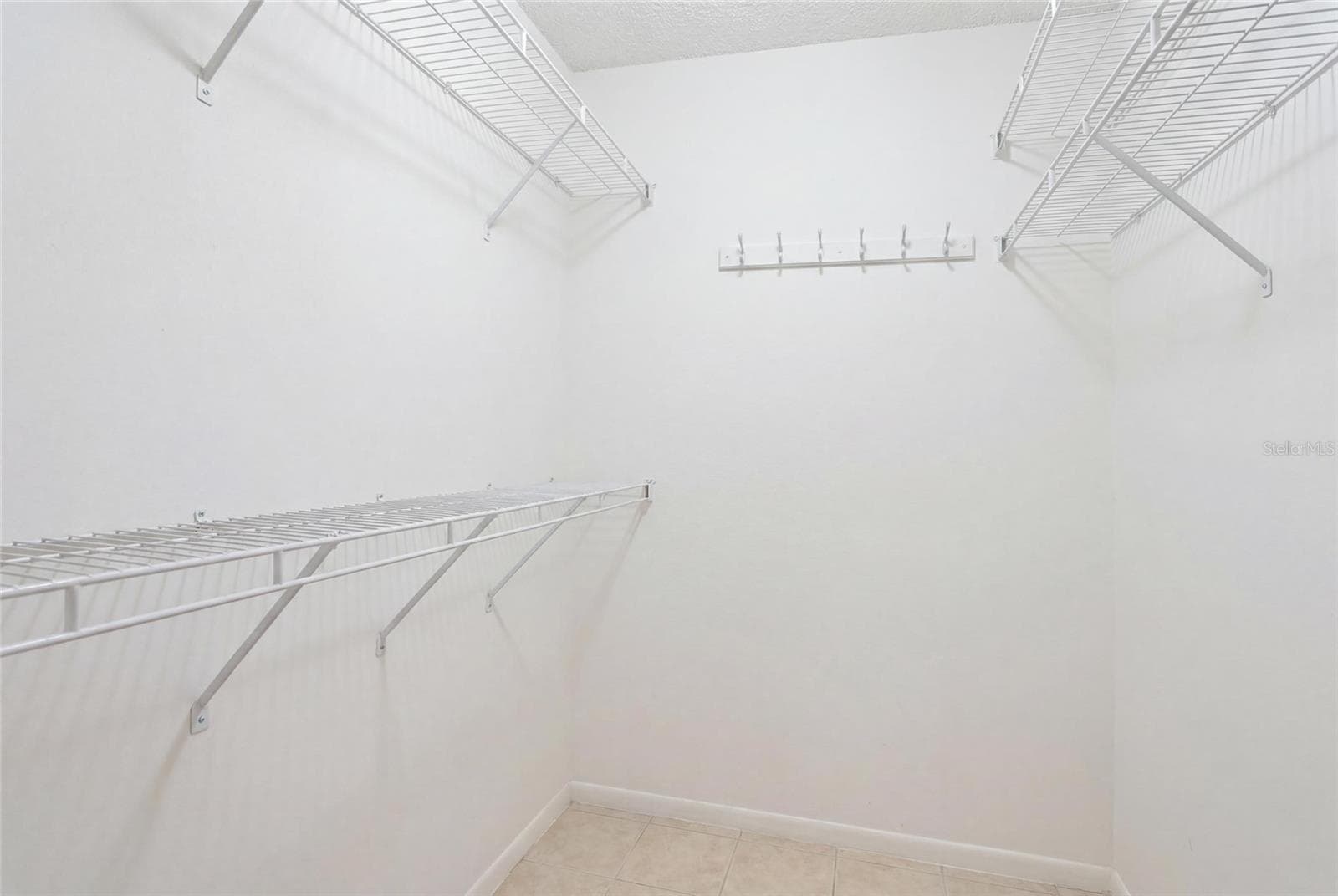 Primary Walk in closet - 2nd floor - 2400 FEATHER SOUND DR #313, CLEARWATER