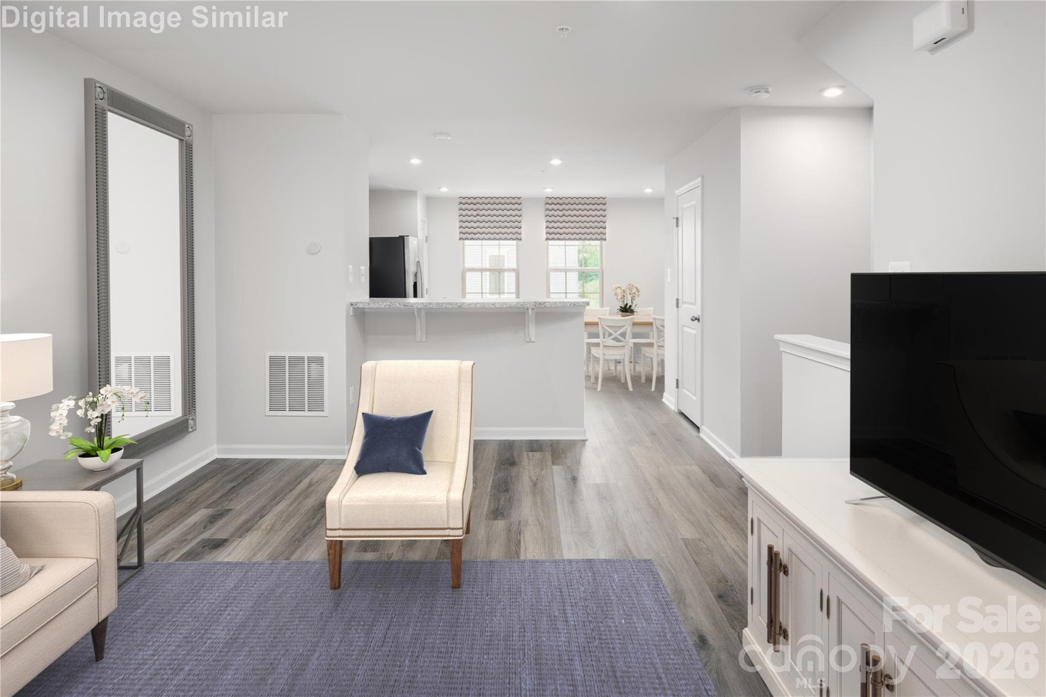 Kick back, relax, and make yourself at home! This spacious living room is all about comfort, light, and room to live your best life! - Charlotte