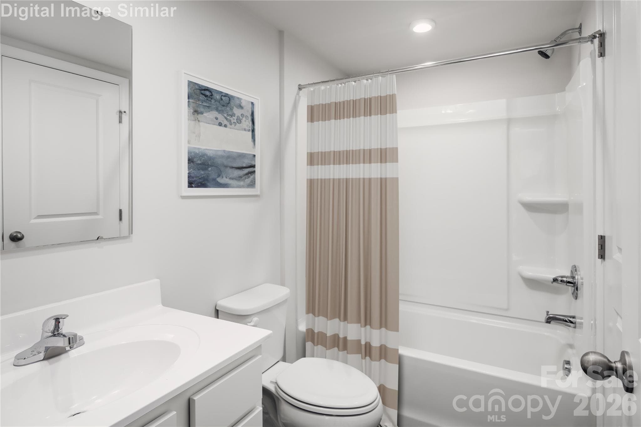 Guest-ready and full of charm! This bathroom features a relaxing tub and plenty of cabinet space — perfect for pampering or quick refreshes! - Charlotte