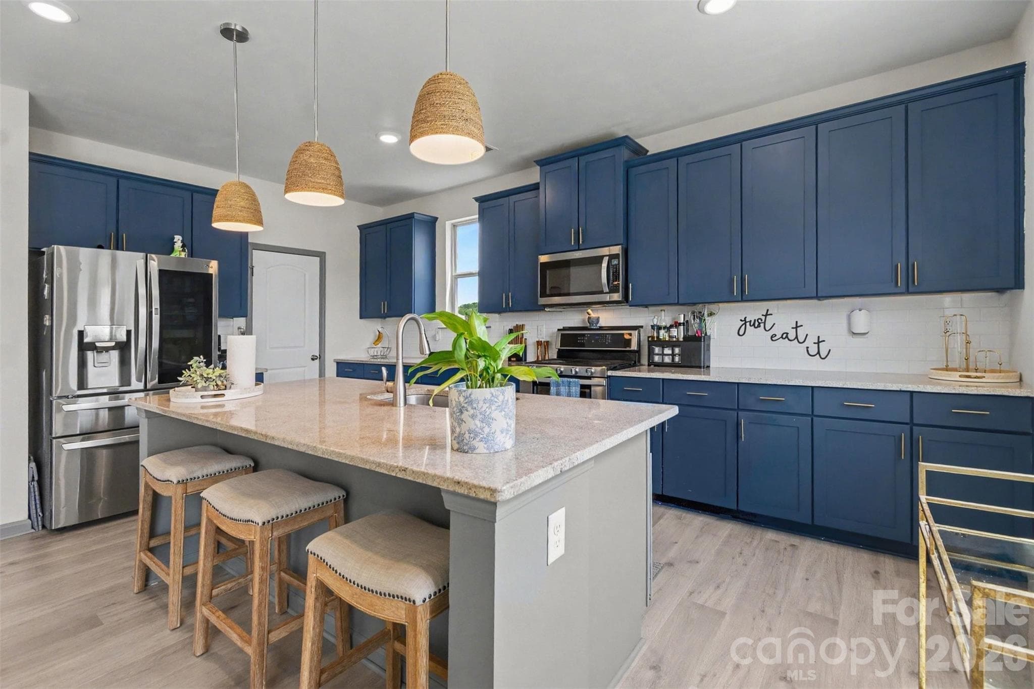 Fantastic Chef's Kitchen with quartz countertops, backsplash, large island and MORE! - 2055 Yearden Lane, Monroe